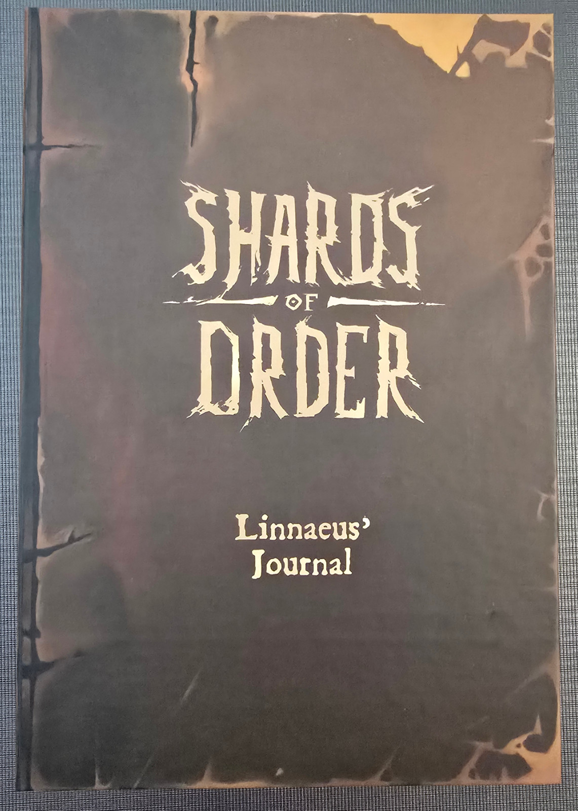 Shards of Order Linnaeus\' Journal Game (Awaken Realms, 2026) - Ultra Rare