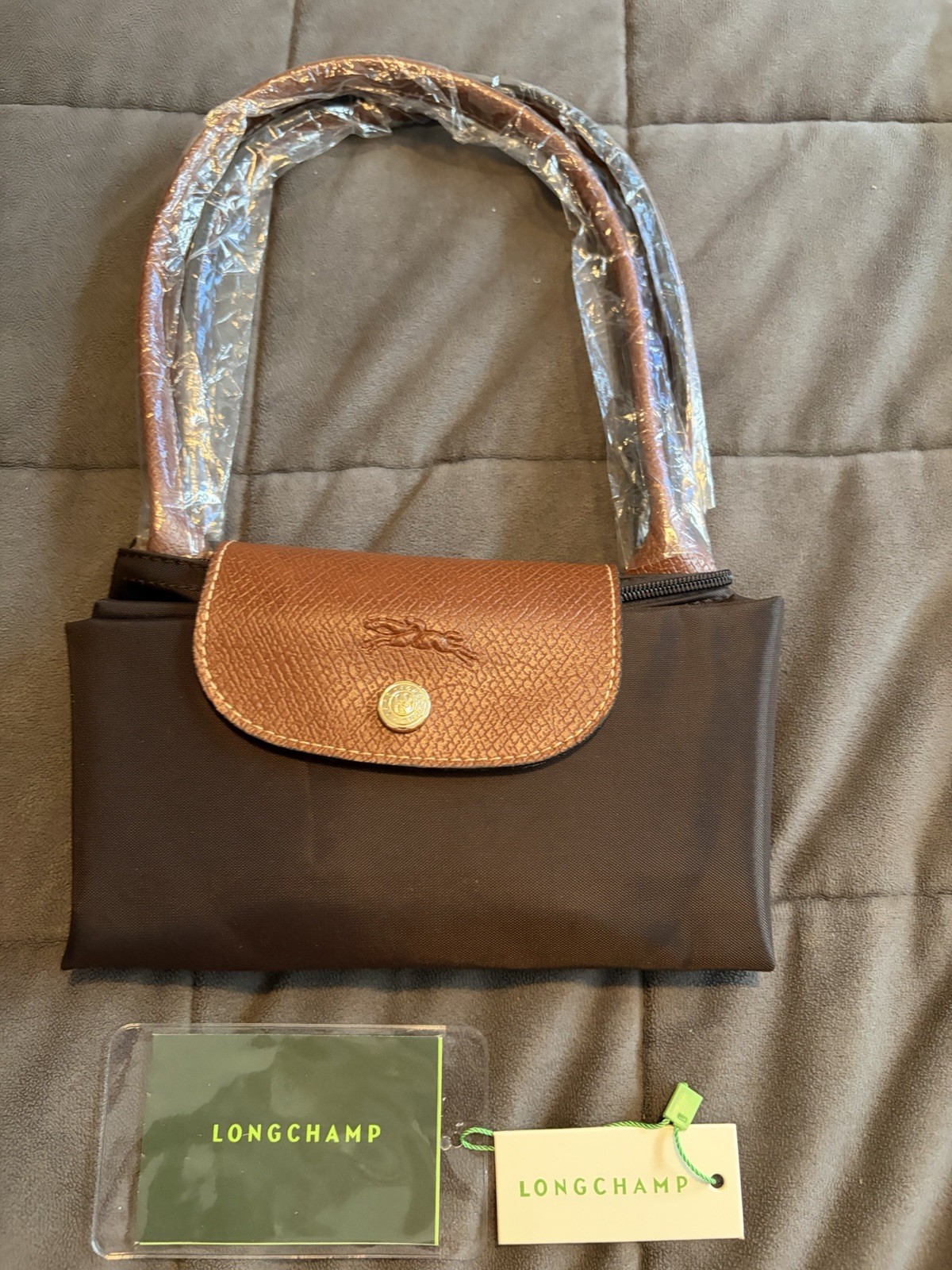Longchamp Le Pliage Tote Bag in Coffee Canvas and brown leather 9 x 11 inch Longchamp Le Pliage Tote Bag in Coffee Canvas and brown leather 9 x 11 inch