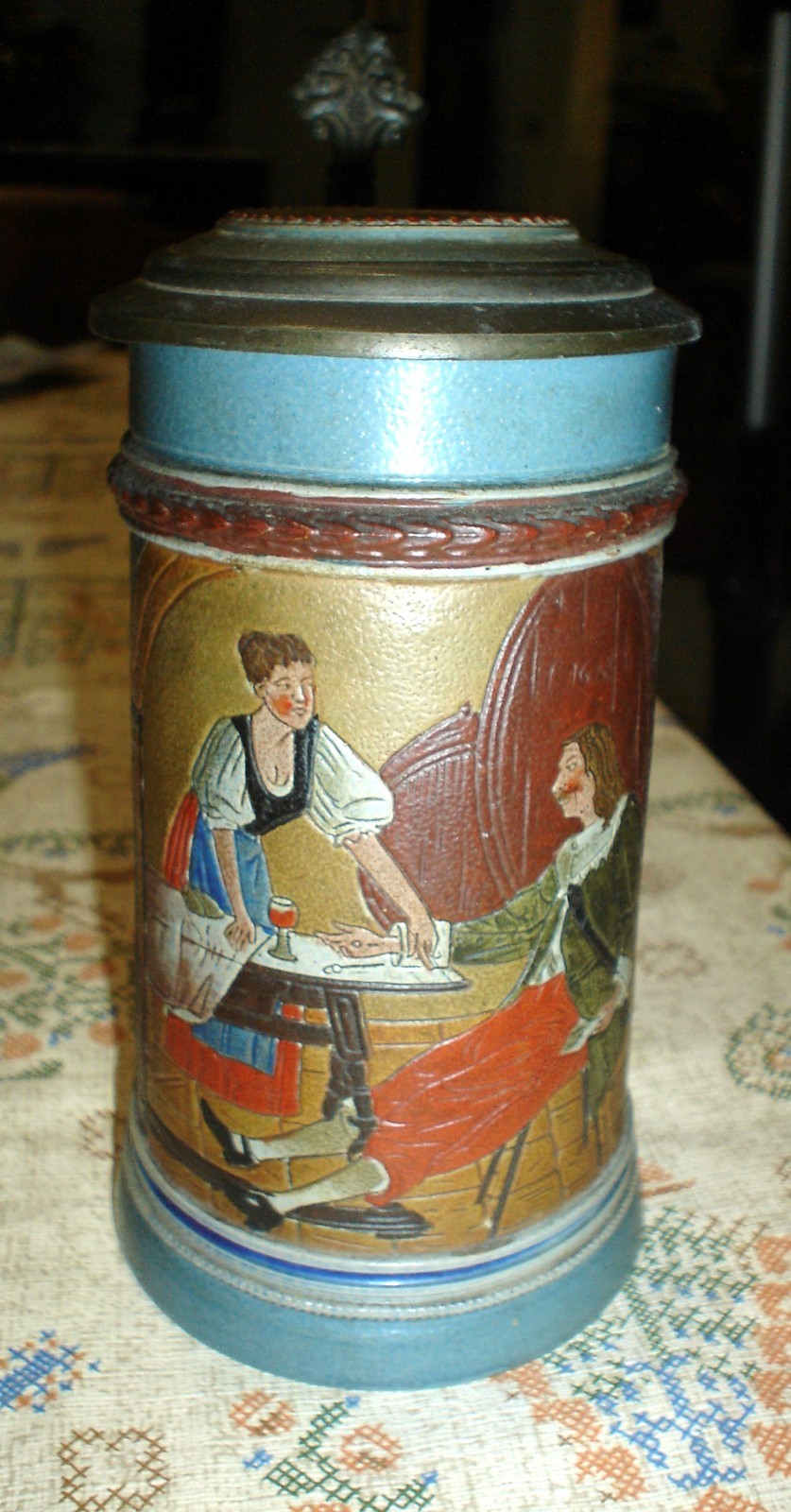 Charming Antique German Figural Stein featuring a Waitress and Patron