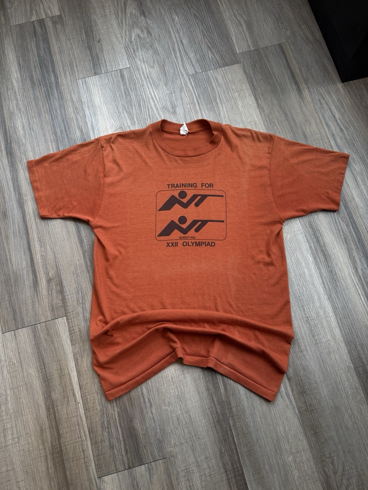 Vintage 1980s Moscow Olympics Shooting Olympiad Faded Orange Tee Vintage 1980s Moscow Olympics Shooting Olympiad Faded Orange Tee