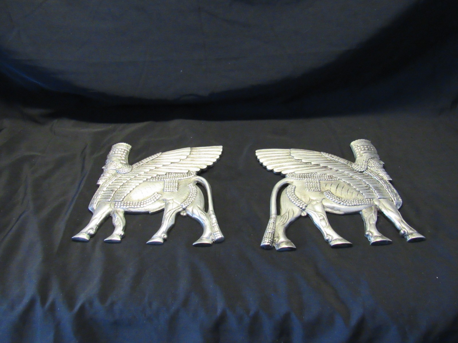 Lamassu Winged Assyrian Bull Cast Metal Opposing Wall Sculptures Lamassu Winged Assyrian Bull Cast Metal Opposing Wall Sculptures