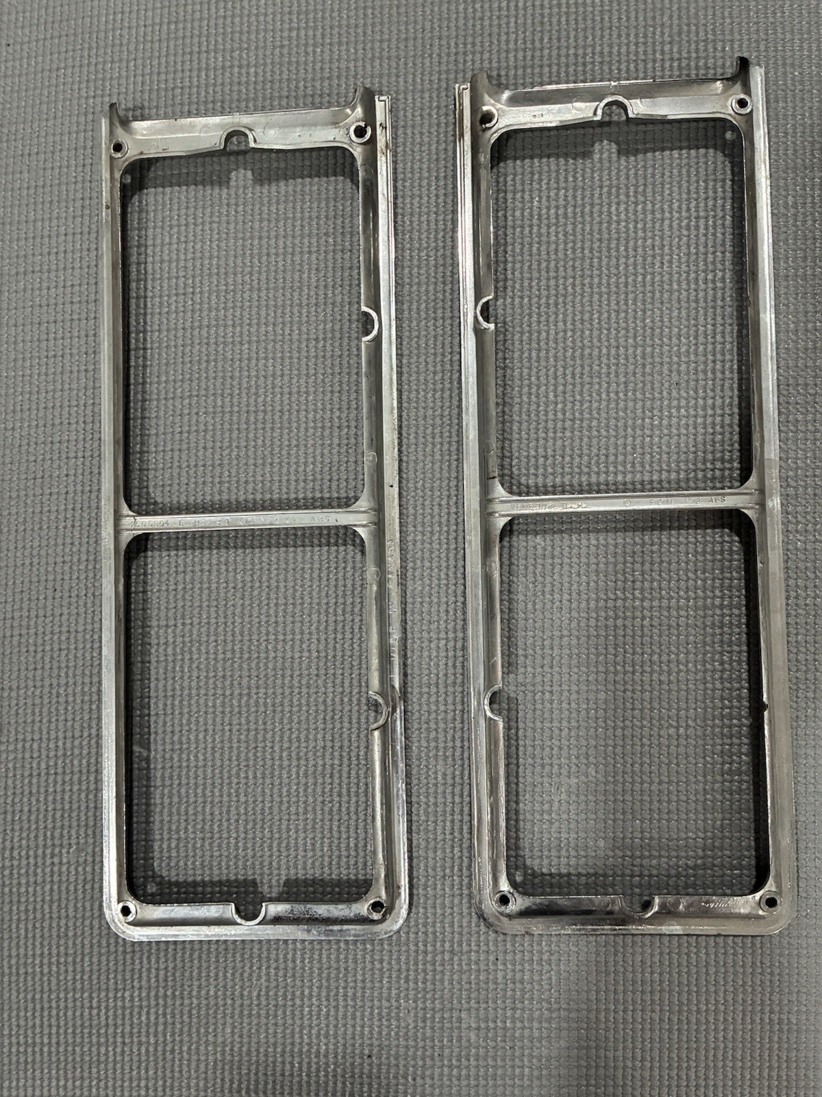 1975 1976 CADILLAC FLEETWOOD AND DEVILLE HEADLIGHT BEZEL PAIR *flaw on one pc* 1975 1976 CADILLAC FLEETWOOD AND DEVILLE HEADLIGHT BEZEL PAIR *flaw on one pc*