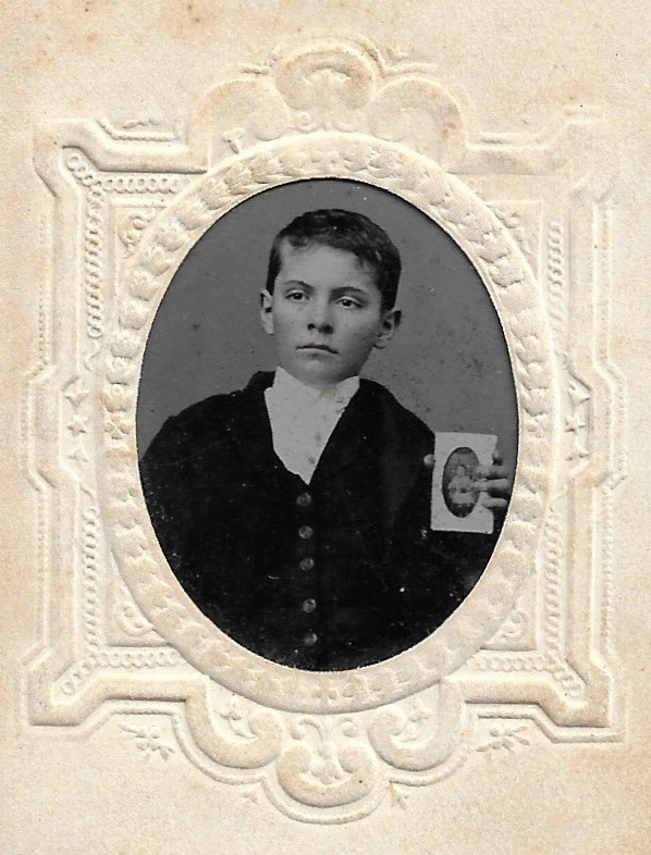 Young Man Holding A Tintype Antique Photo Young Man Holding A Tintype Antique Photo