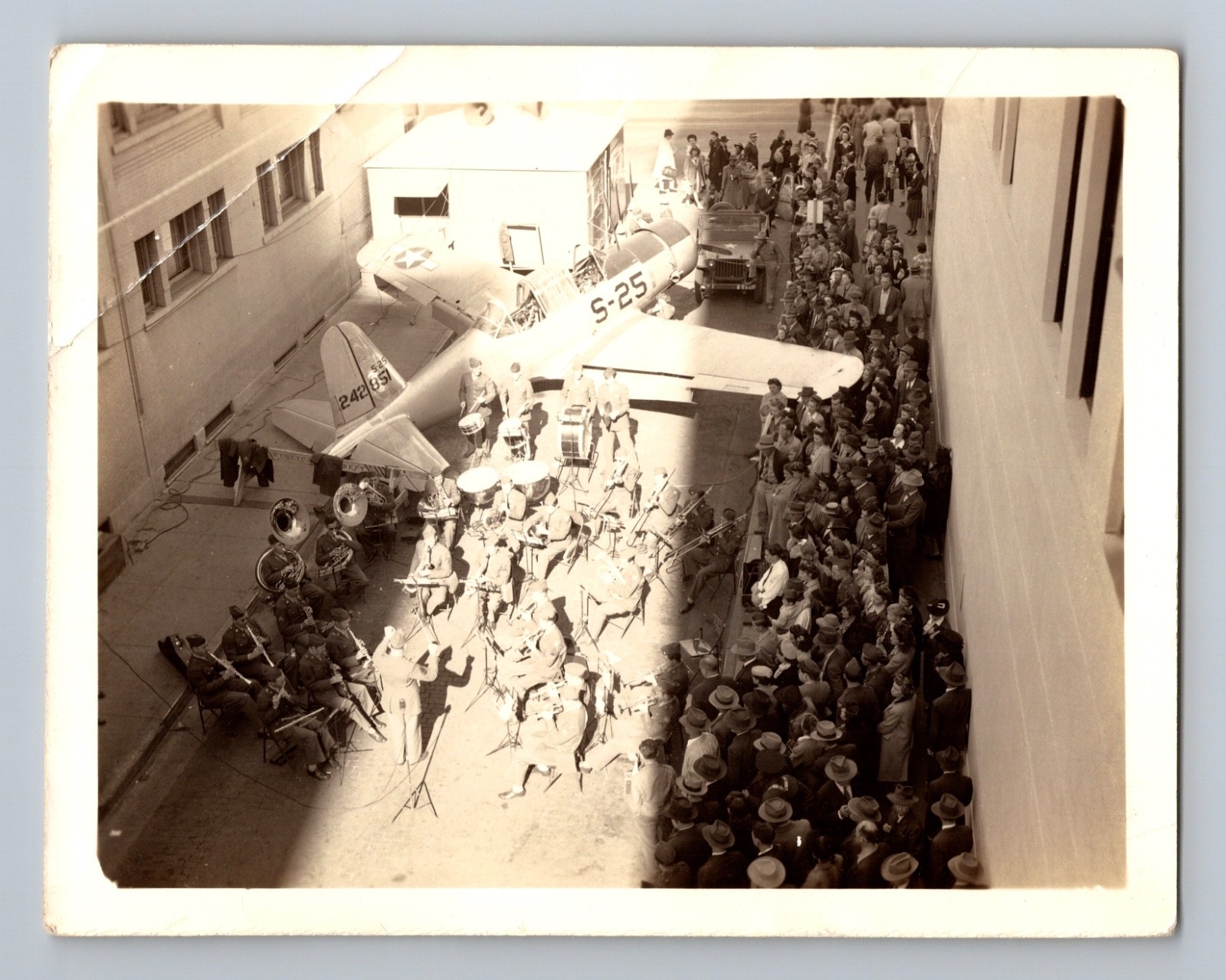 WWII Army Band Performs By Vultee BT-13 Valiant Aircraft For Civilians Photo