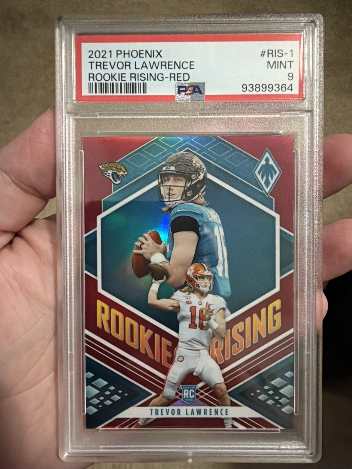 2021 Panini Phoenix-Trevor Lawrence #RS-1 Rookie Rising-Red /199 - PSA 9 2021 Panini Phoenix-Trevor Lawrence #RS-1 Rookie Rising-Red /199 - PSA 9
