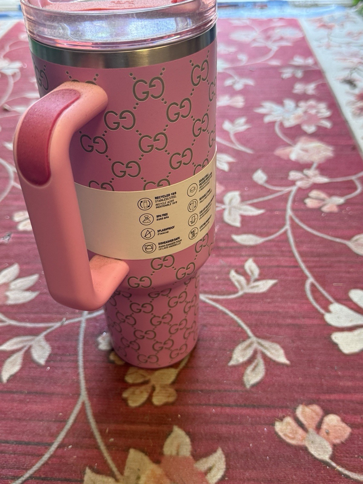 A Pink Insulated Travel Tumbler Featuring A Designer-inspired Interlocking Lid