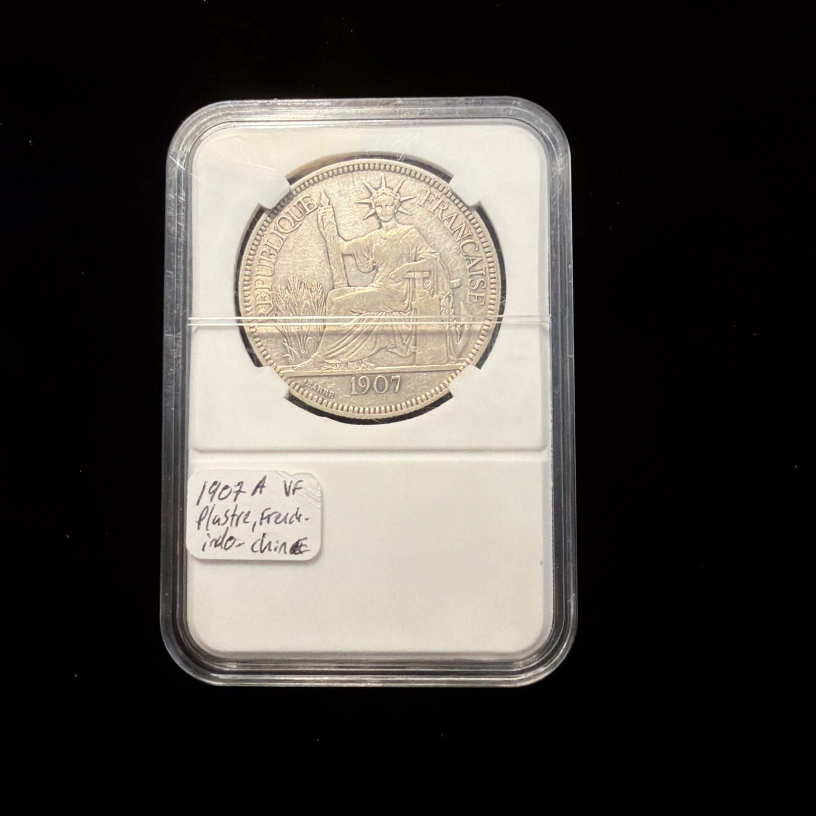 1907- A FRENCH INDO CHINA SILVER PIASTRE VF, Slab Case Included 1907- A FRENCH INDO CHINA SILVER PIASTRE VF, Slab Case Included