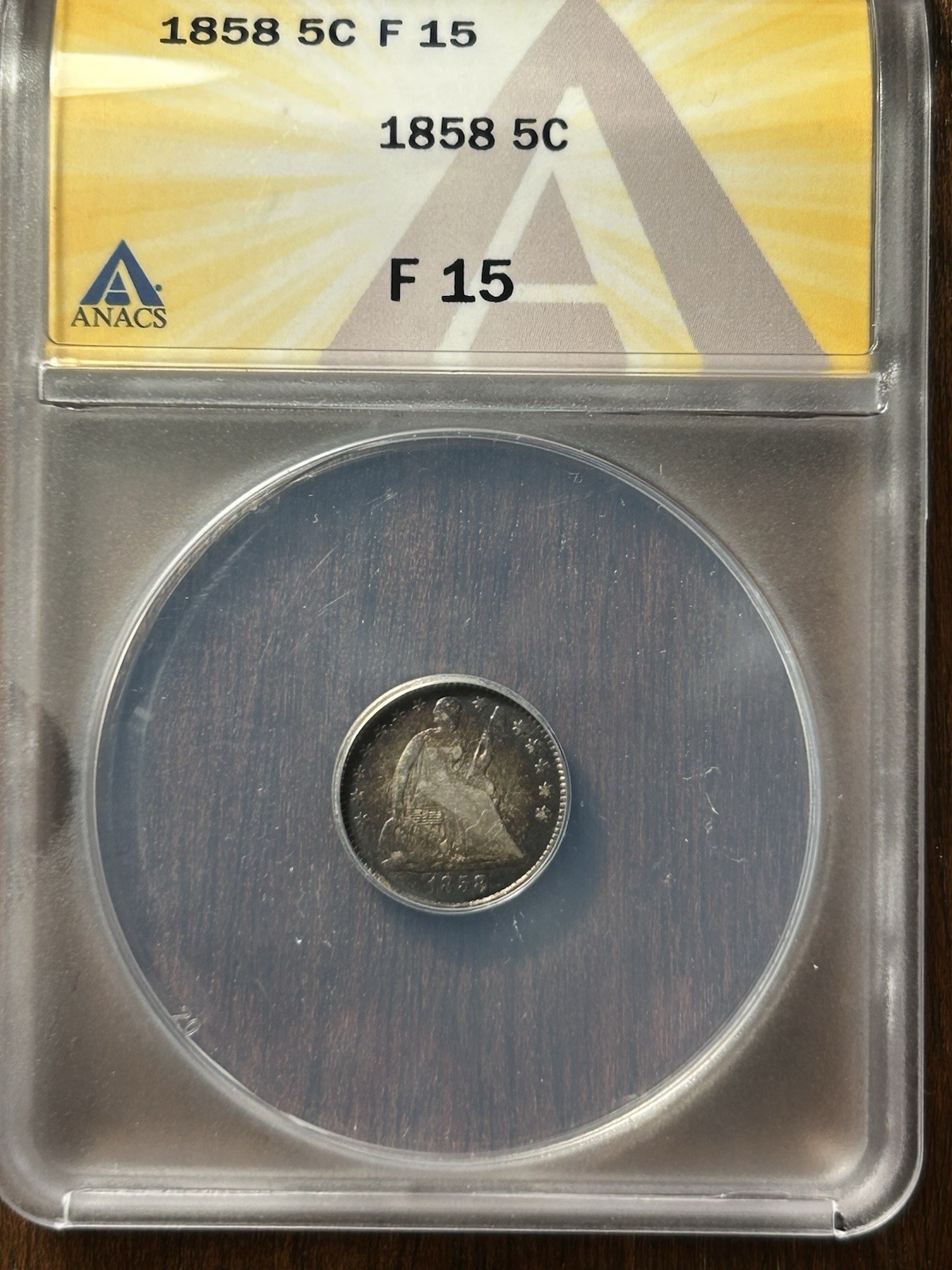 1858 5c seated liberty half dime ANACS F-15 Straight Grade 1858 5c seated liberty half dime ANACS F-15 Straight Grade