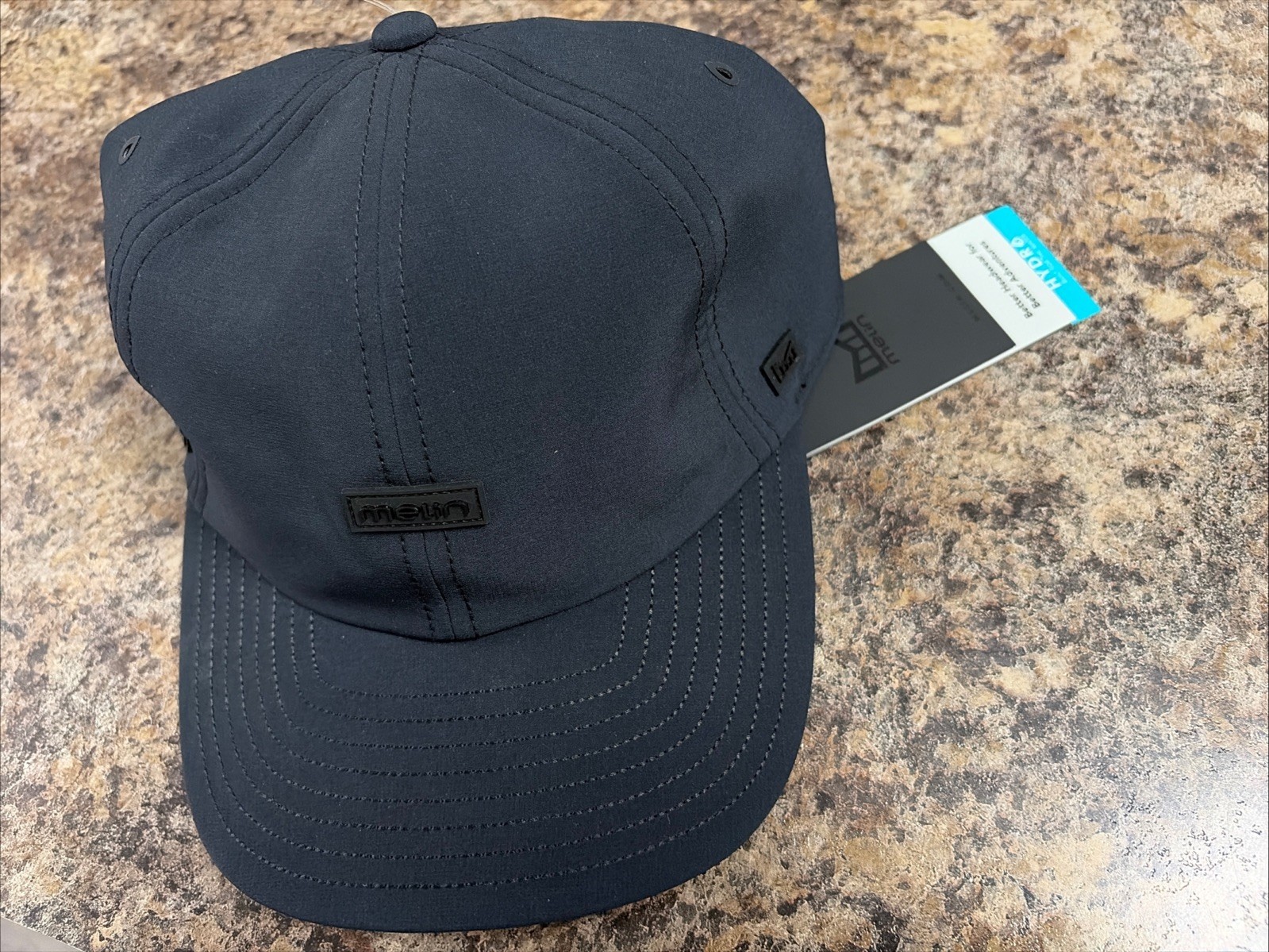 ✅NWT melin Performance Hat Mens Classic Strap Back HYDRO BLACK Water Resistant