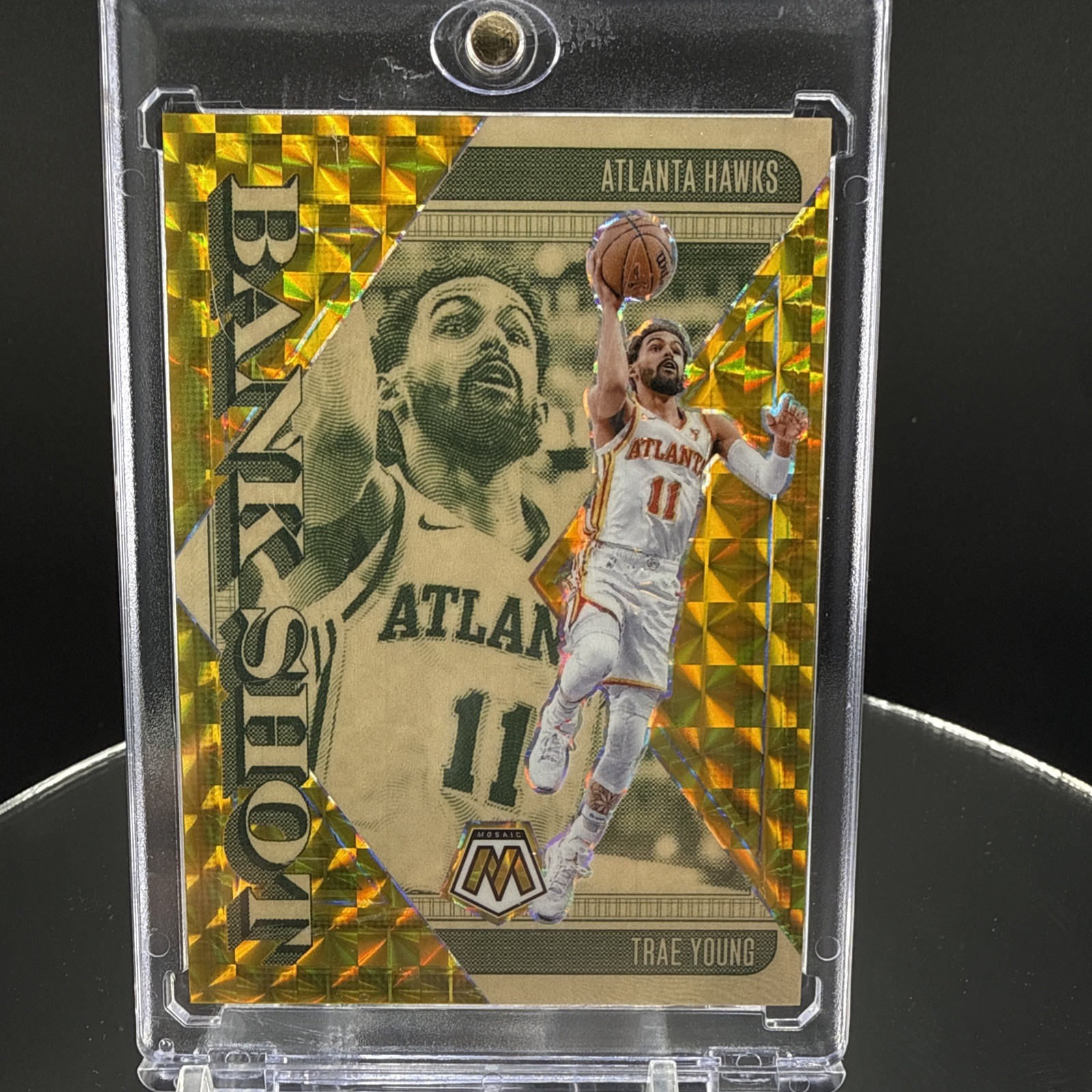 Trae Young 2024-25 Panini Mosaic Bank Shot Gold Mosaic 7/10 Trae Young 2024-25 Panini Mosaic Bank Shot Gold Mosaic 7/10