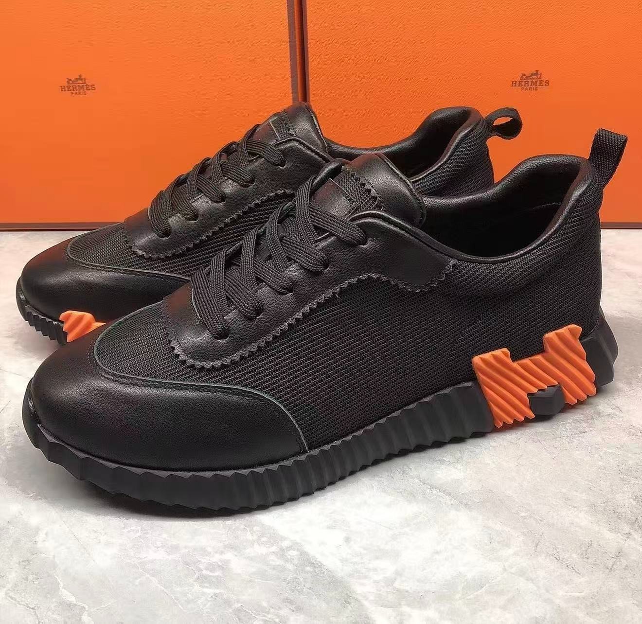 Hermès Unisex Black Mesh Leather Sneakers Orange Serrated Sole Lace‑Up Luxury 