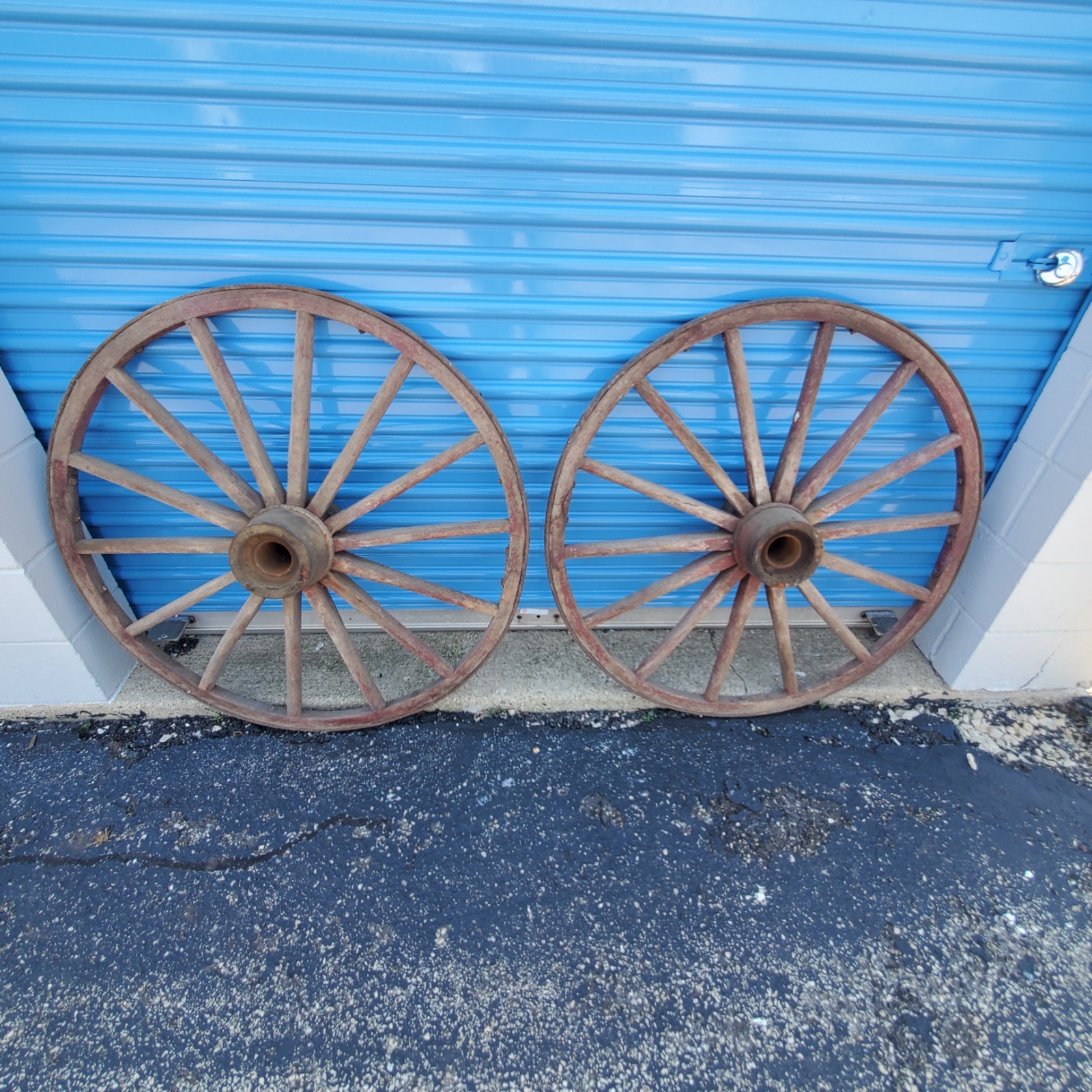 A MATCHED set of 4- ANTIQUE WOOD WAGON WHEELS A MATCHED set of 4- ANTIQUE WOOD WAGON WHEELS