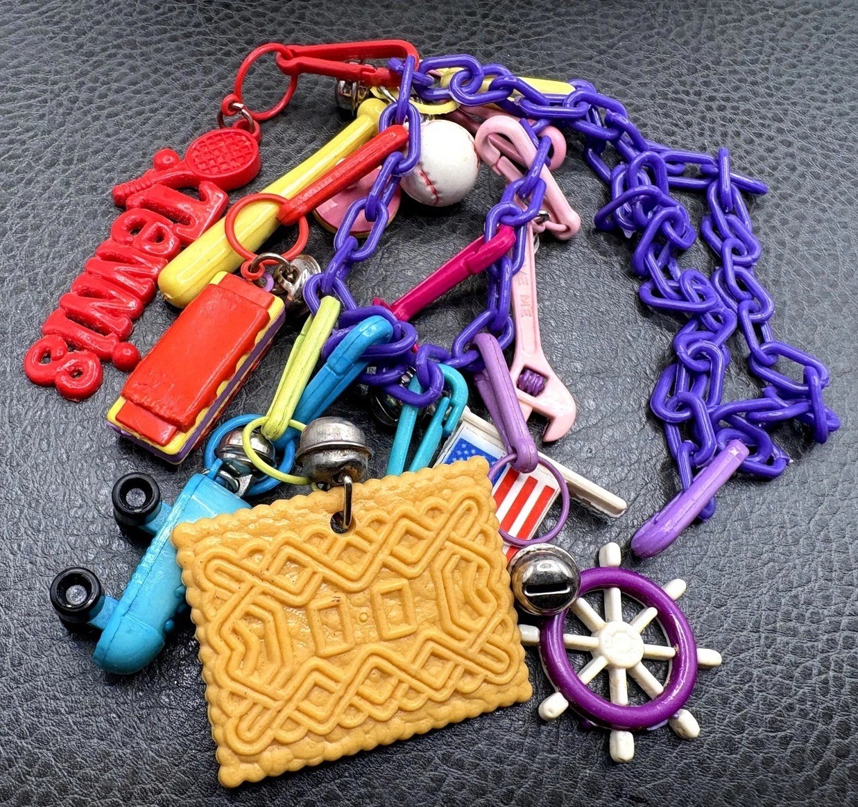 VTG 1980s Plastic Bell Charm 22” Necklace Purple Chain Tennis Cookie Flag Bells