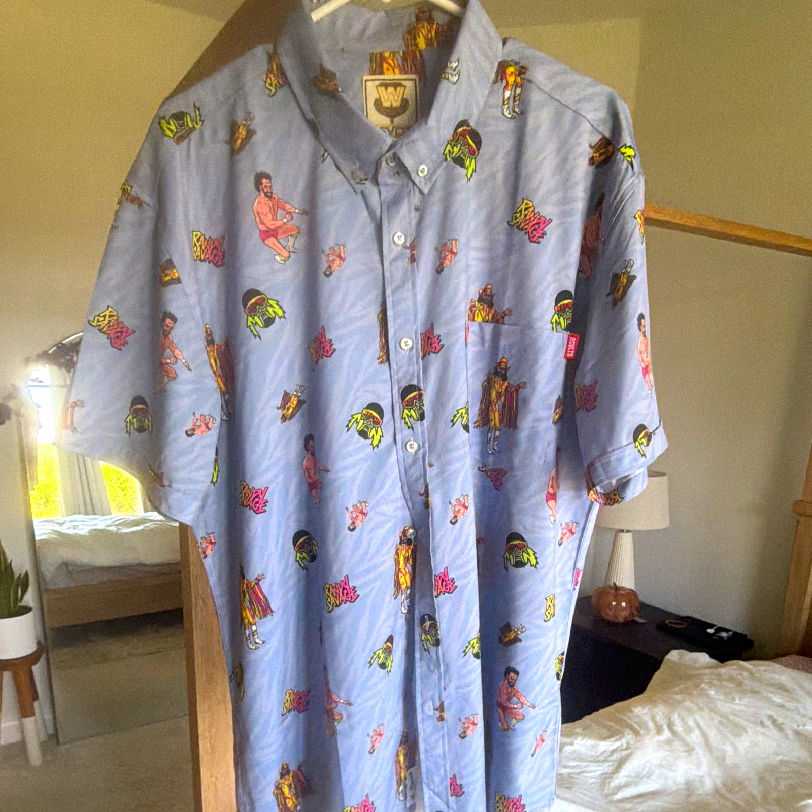 RSVLTS WWE Cartoon Graphic Print Blue Short Sleeve Button-Up Pocket Shirt XL RSVLTS WWE Cartoon Graphic Print Blue Short Sleeve Button-Up Pocket Shirt XL