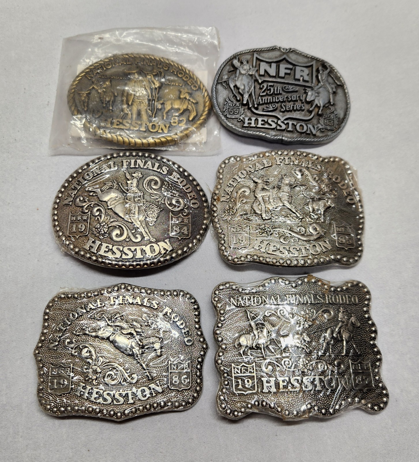 VtG Hesston National Finals Rodeo Belt Buckle Lot Of 6 Collector Series 1982-87