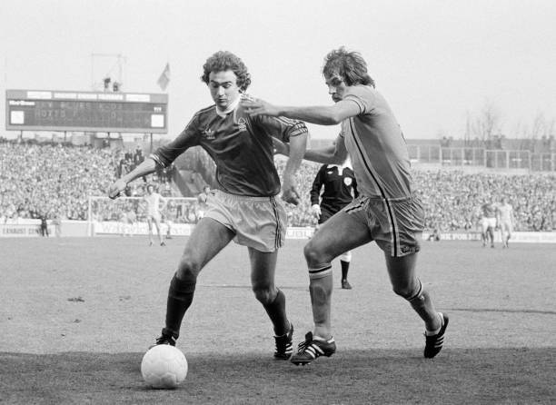 Martin O\'Neill of Nottingham Forest is challenged by Jim Holton of- Old Photo