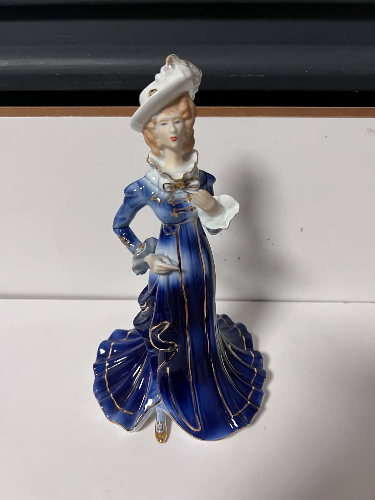 Vintage Porcelain Figurine – Elegant Lady in Cobalt Blue & Gold Dress Vintage Porcelain Figurine – Elegant Lady in Cobalt Blue & Gold Dress