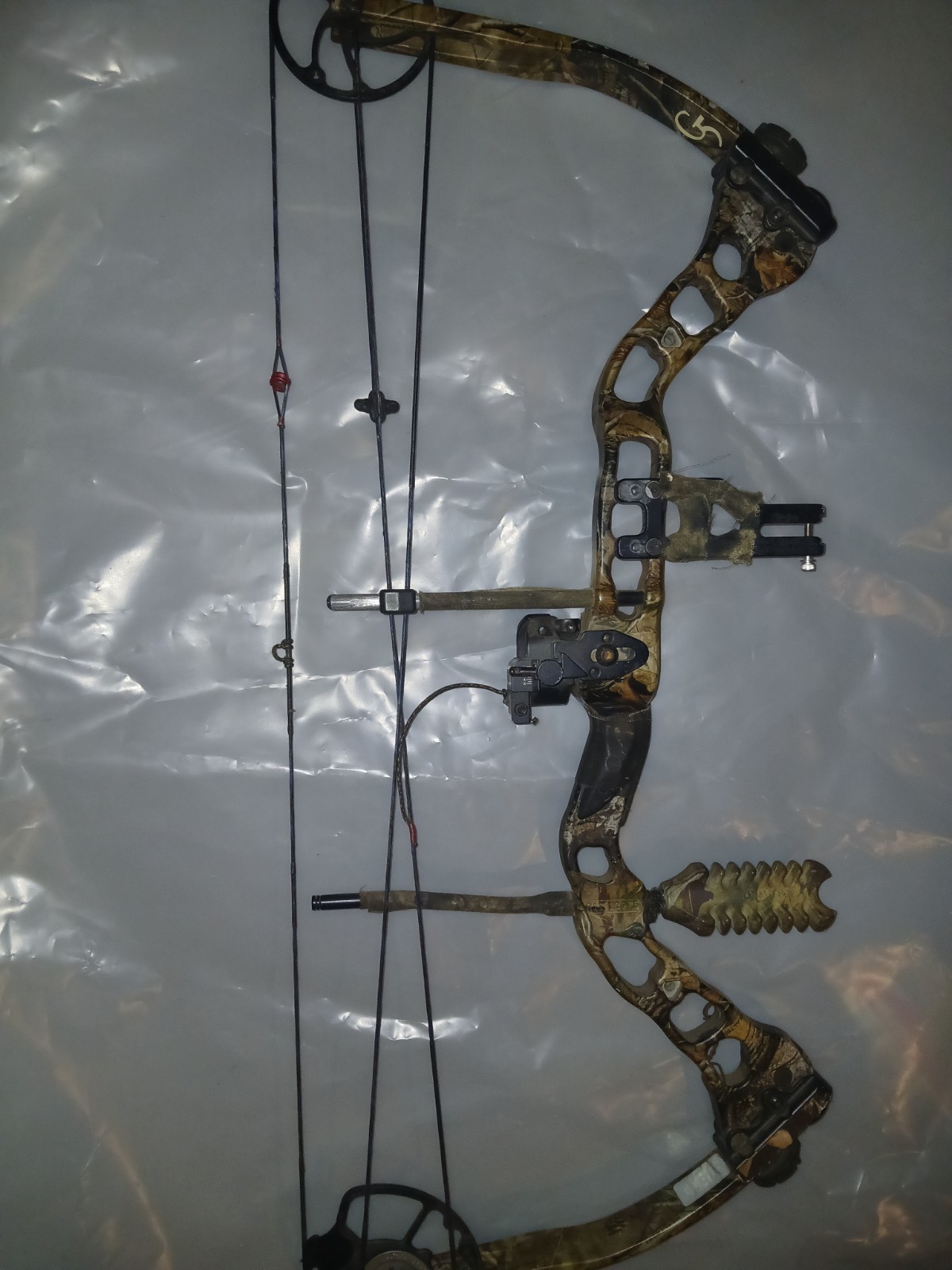 Quest G5 Rogue compound hunting bow configured in a camo finish.