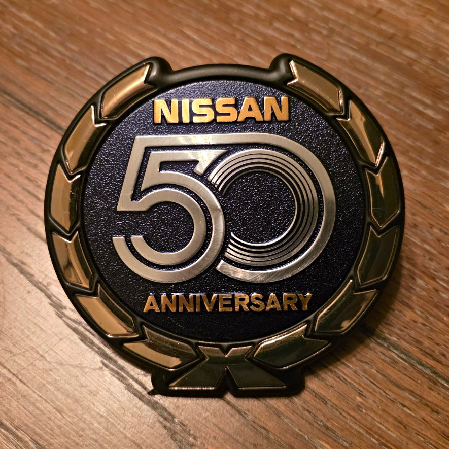 Vintage Nissan 50th Anniversary Badge. New Never Used Vintage Nissan 50th Anniversary Badge. New Never Used