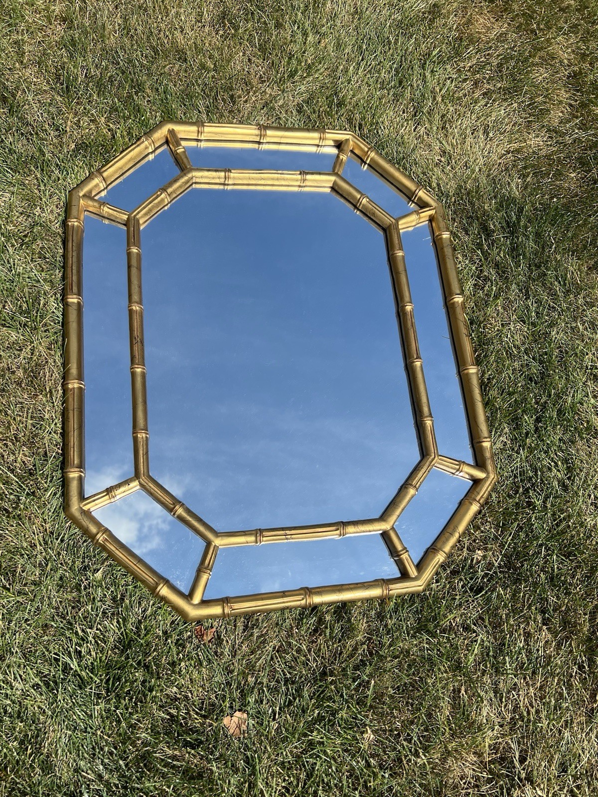 Vintage gold faux bamboo octagonal wall mirror with a double-frame design.