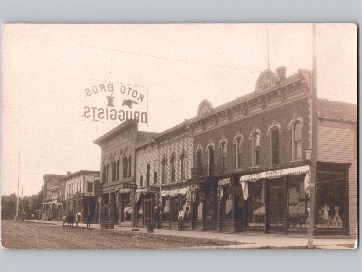 c1910 Main Street Koto Bros Druggists Drug Forest City Iowa IA RPPC Real Photo