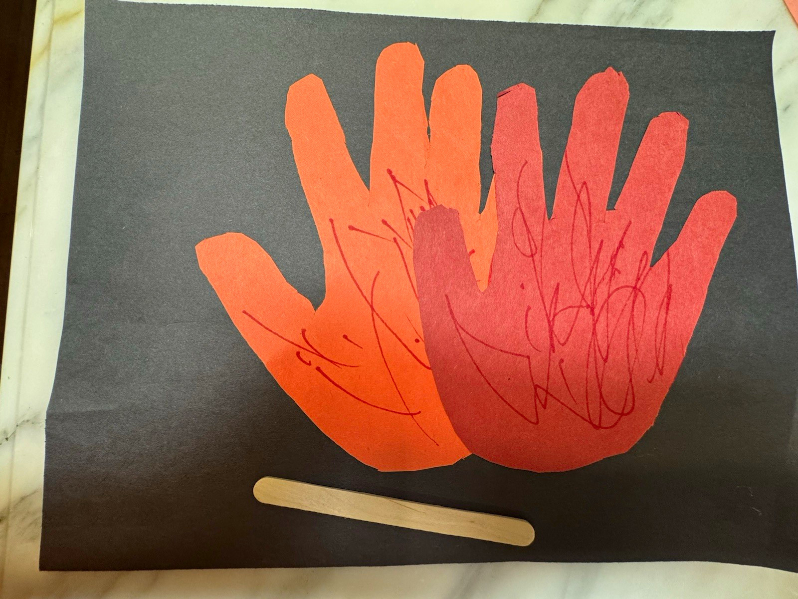 Abstract Hands Painting on Black Paper with Wooden Craft Stick Abstract Hands Painting on Black Paper with Wooden Craft Stick