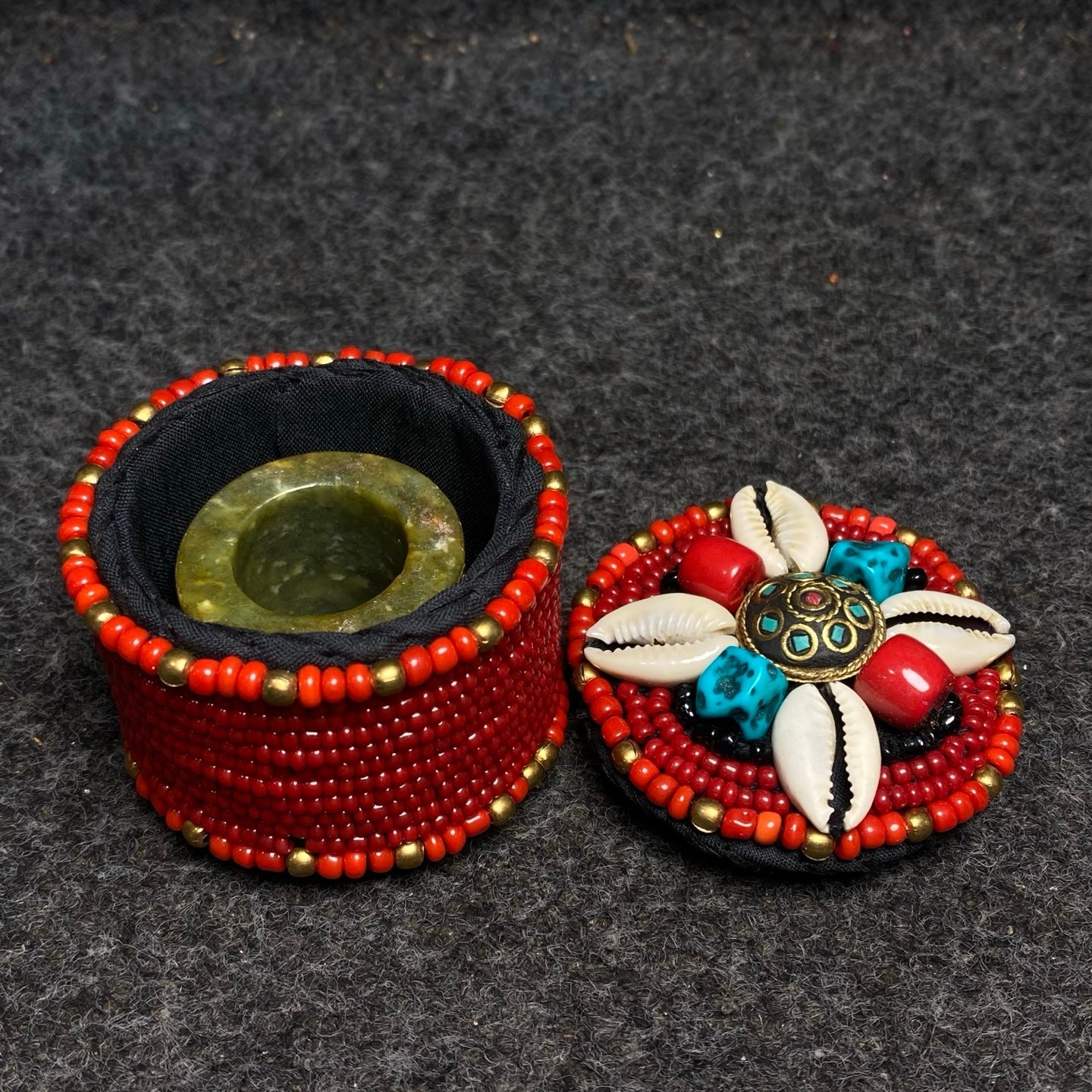 Hand sewn turquoise shell jewelry box with precious antique jade fingers inside