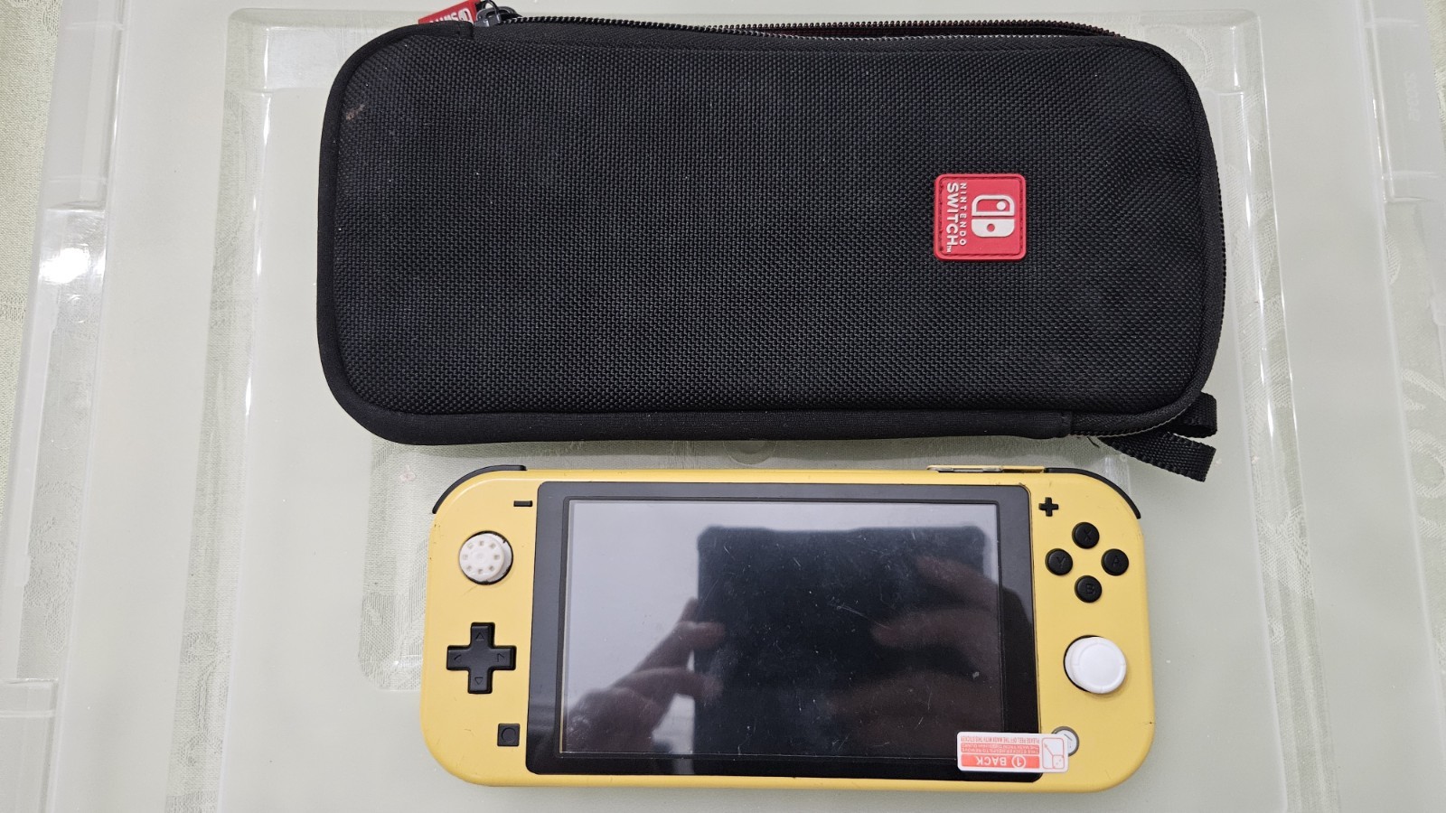 Broken Nintendo Switch Lite Yellow Handheld Console With Black Case. Parts Only.