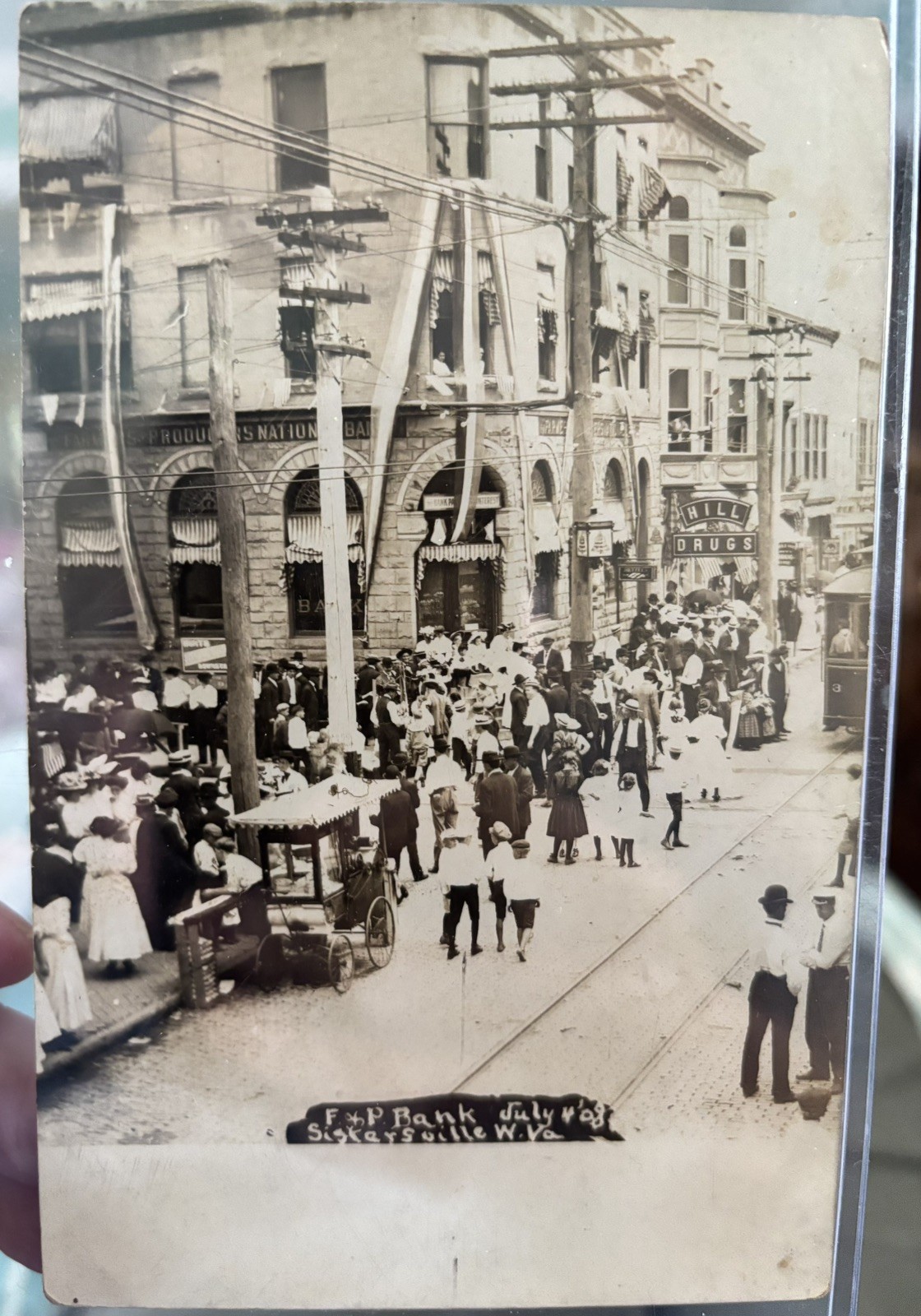 1908 RPPC 4 of July St Scene F & P Bank Hill Drug Peanut Cart Trolley Missent