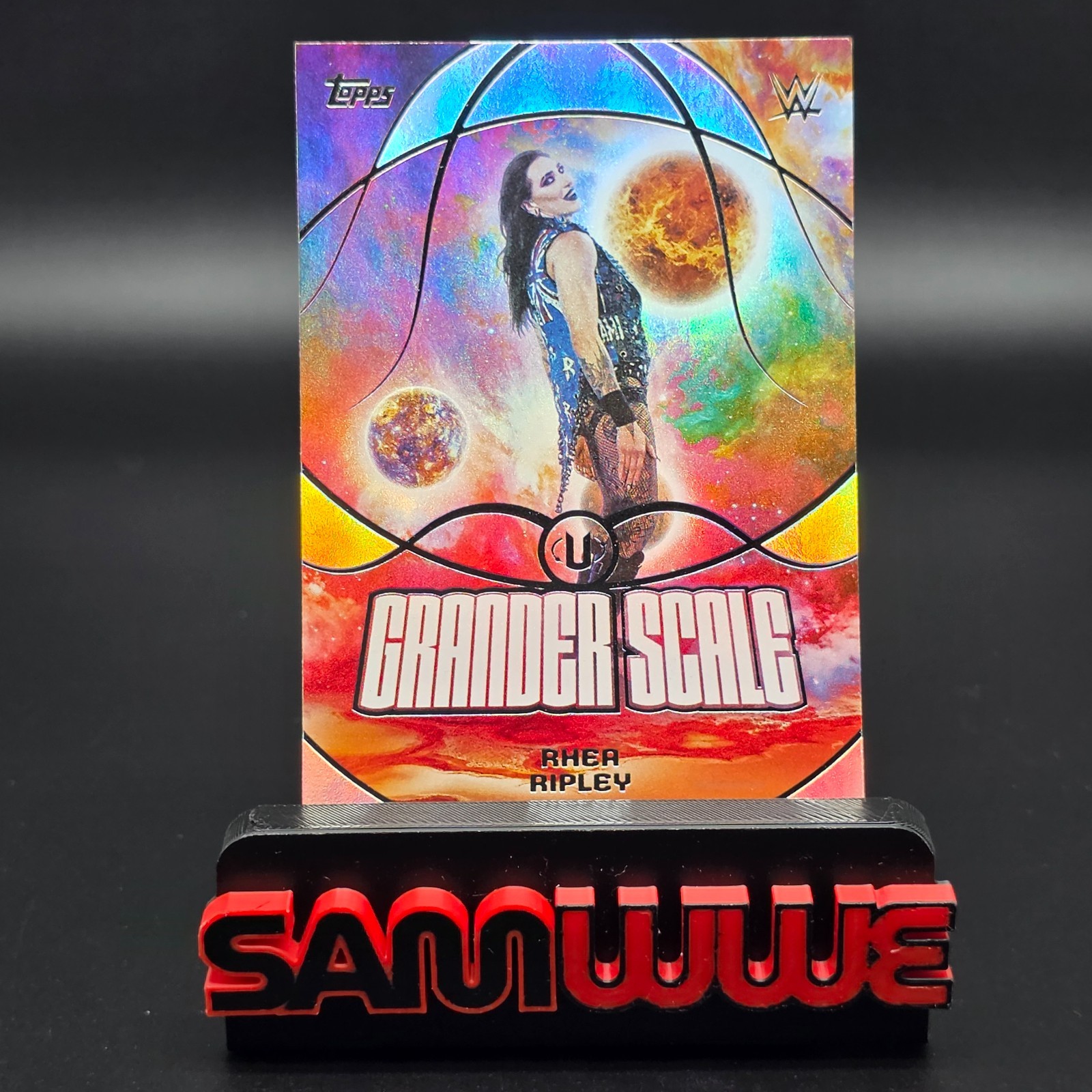 2026 WWE Topps Universe Rhea Ripley Grander Scale Insert #GS-16