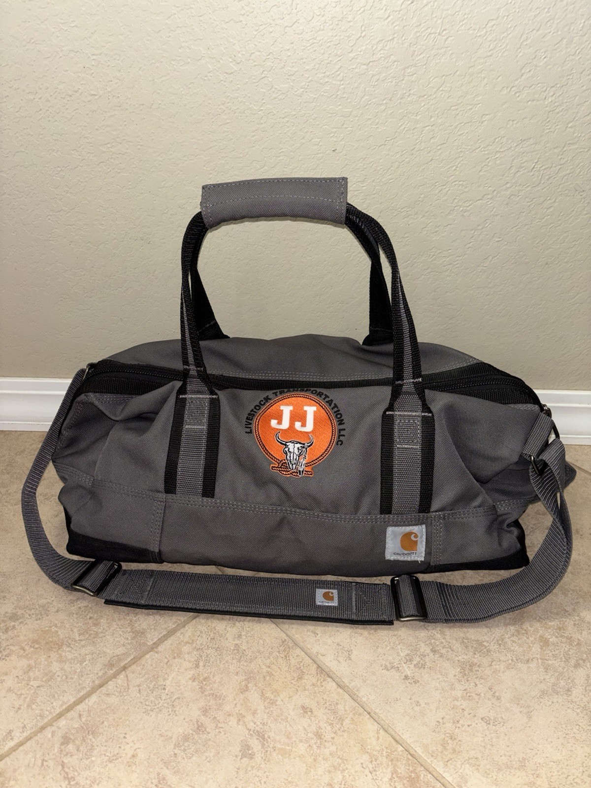 Carhart Grey And Black Duffel Bag.       20in By 11in.       2 in stock