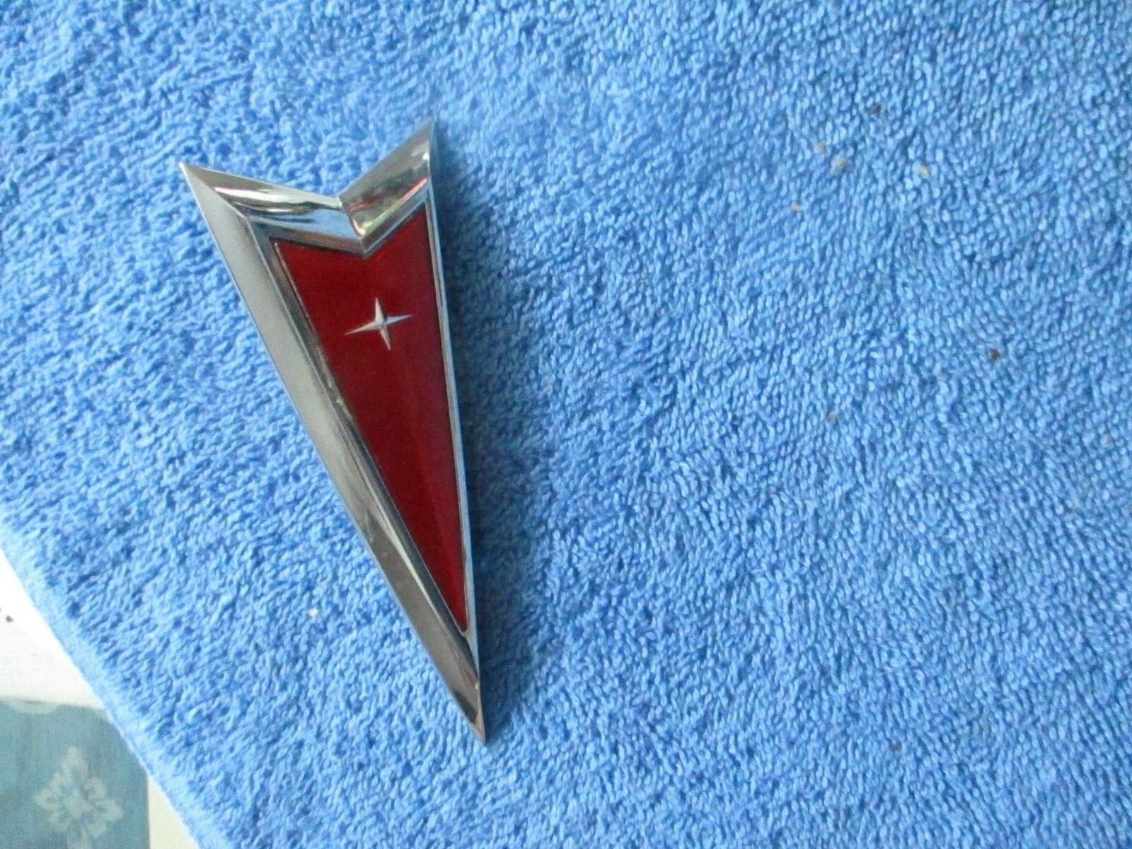 NOS 1976-1980 PONTIAC SUNBIRD DIECAST METAL HEADER PANEL EMBLEM-PART 499791