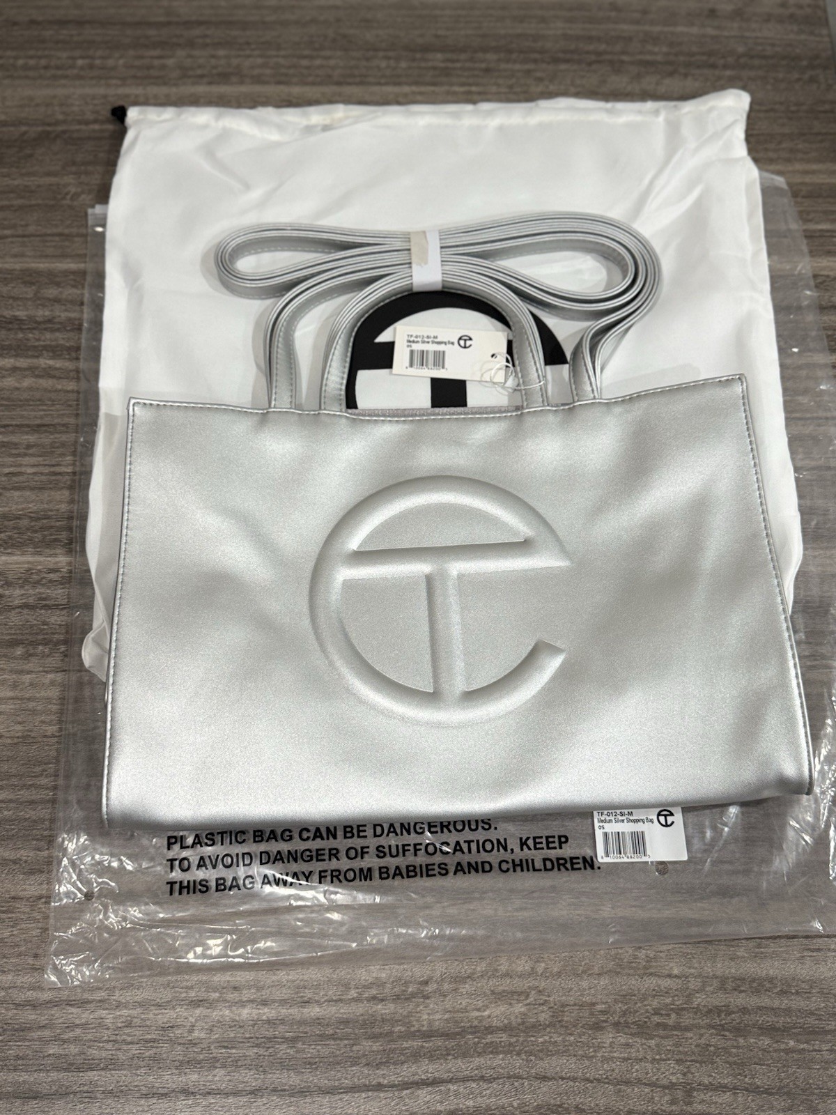 Telfar Medium Shopping Bag/Purse With Dustbag Silver NWT Dustbag NEW 15X10X7 Telfar Medium Shopping Bag/Purse With Dustbag Silver NWT Dustbag NEW 15X10X7