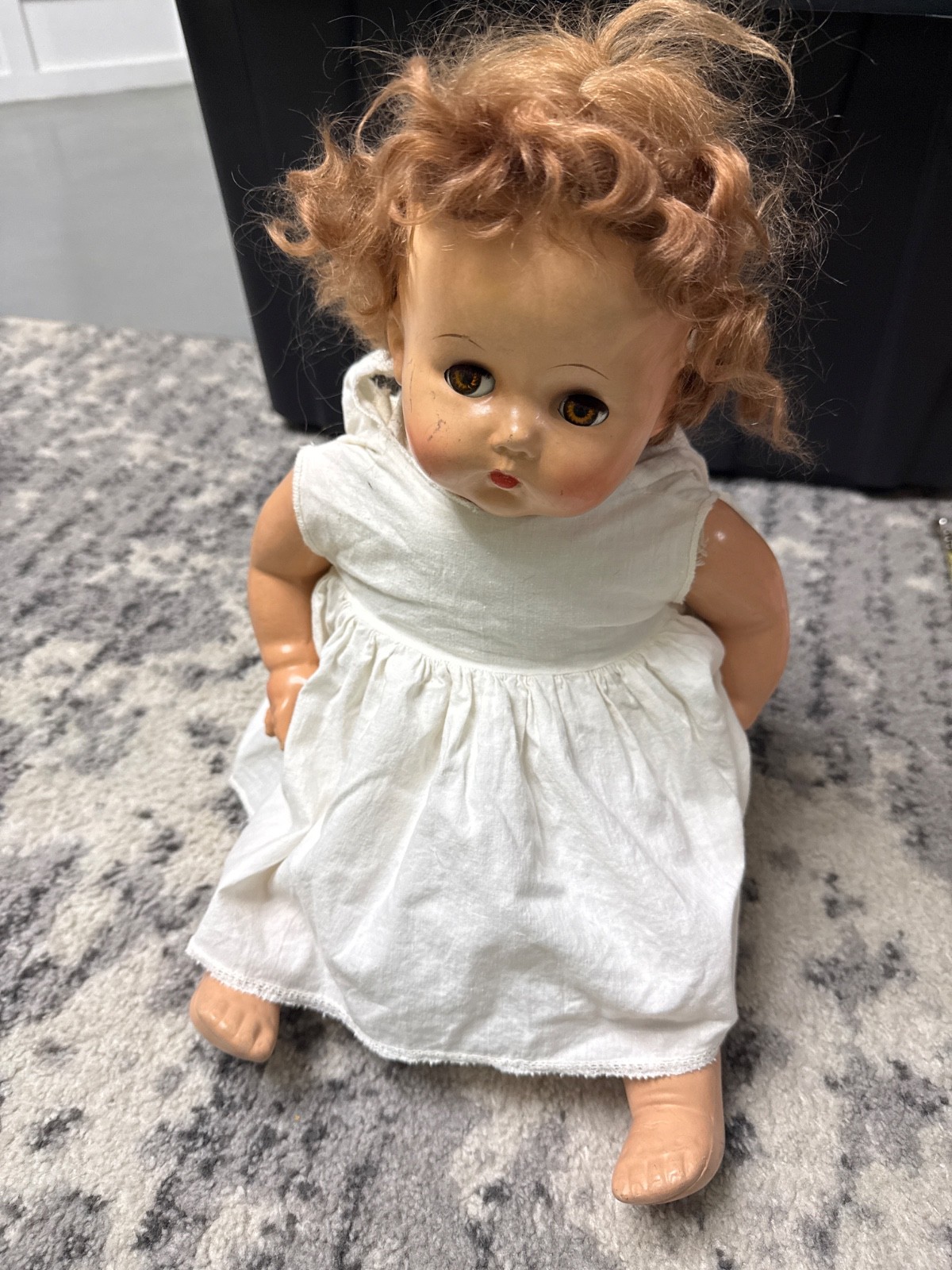 vintage mid-20th-century baby doll, resembling classic composition or hard-plast
