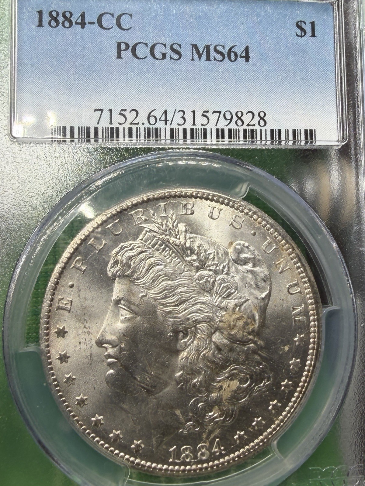 1884 CC Carson City Mint Morgan Silver Dollar $1 PCGS MS 64 1884 CC Carson City Mint Morgan Silver Dollar $1 PCGS MS 64