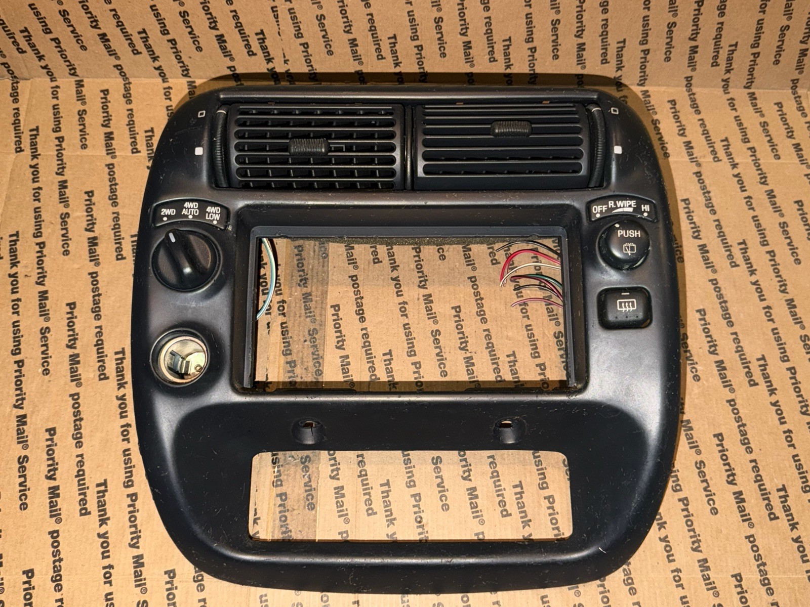 F57B-7804302-CW  1995-2003 Ford Ranger OEM Center Dash Bezel 4WD Black Wiper