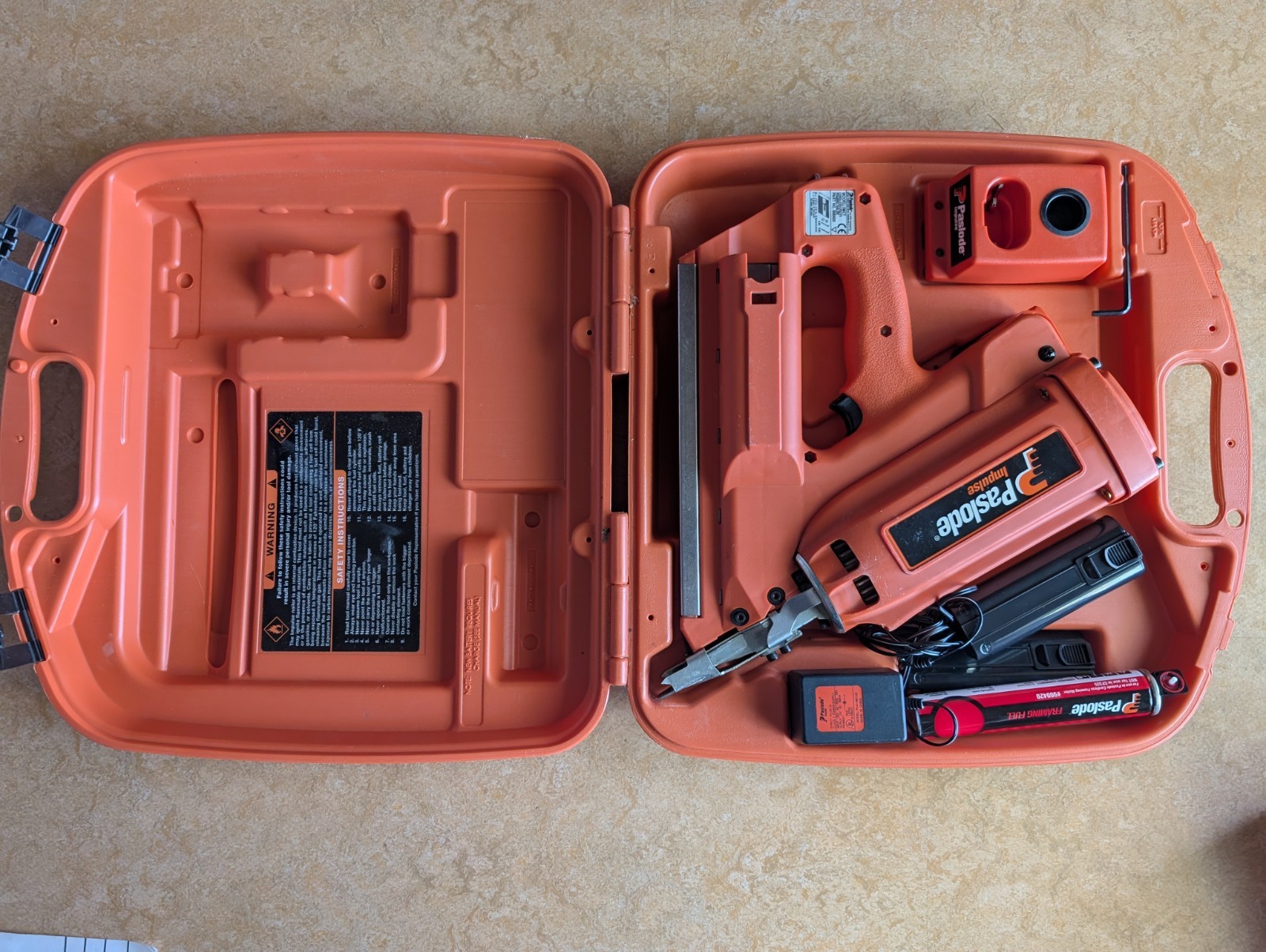 Paslode Cordless Framing Nailer Model 900420 and charger, case, and fuel cell