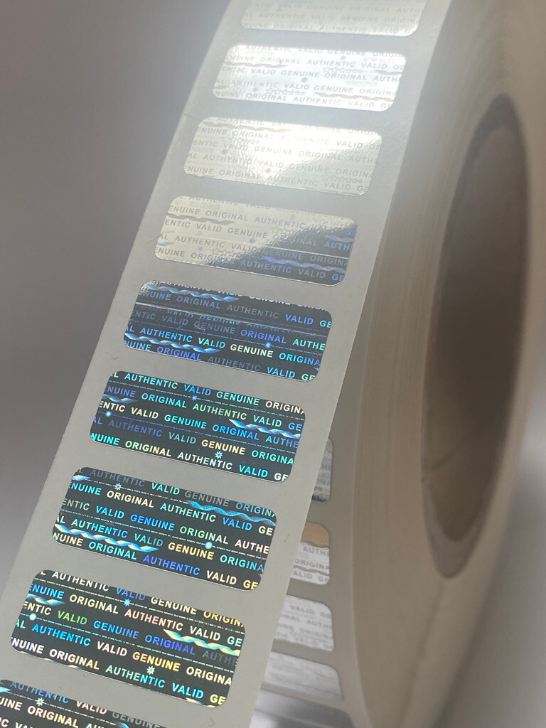 10,000 ROLL BRIGHT SILVER HOLOGRAM VOID SECURITY LABELS - 1.5 X .50 IN.