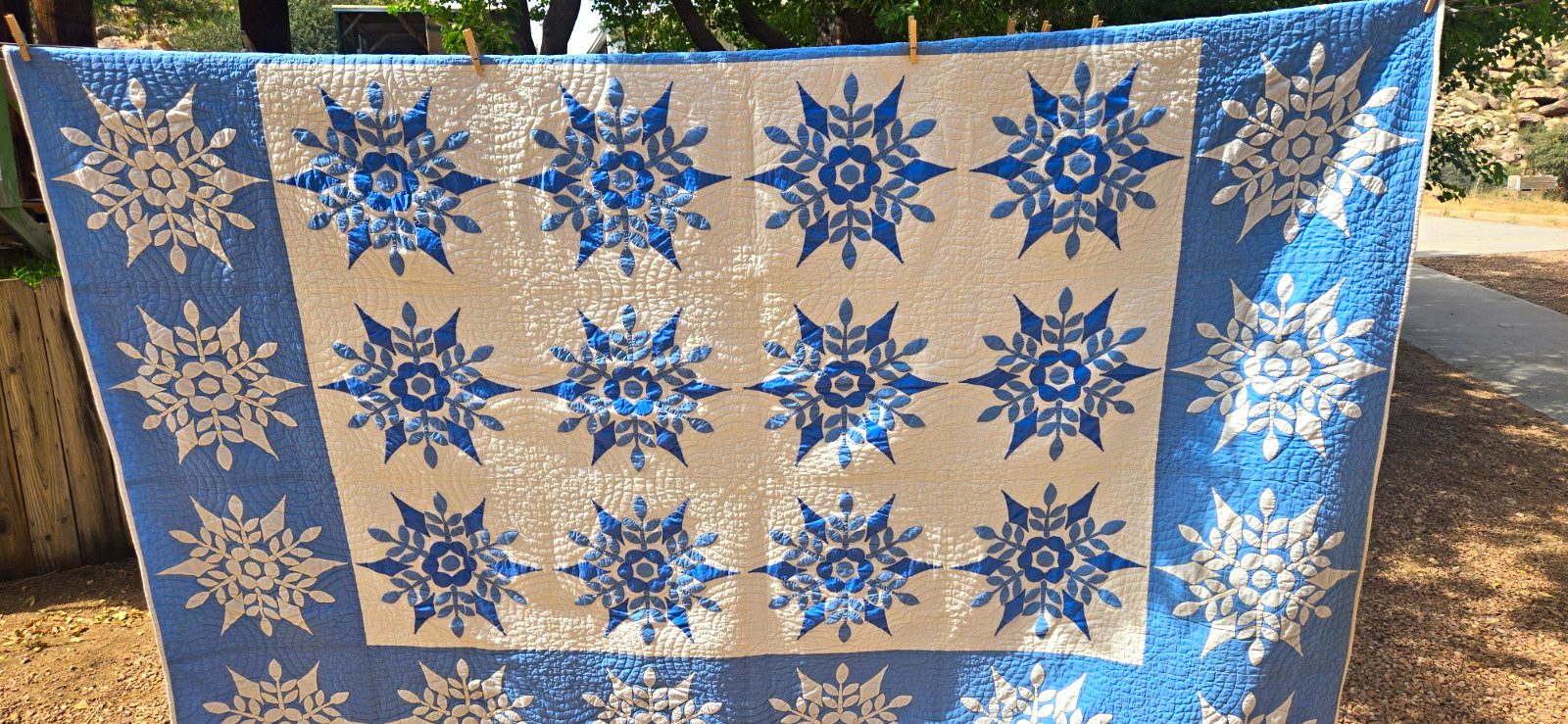 antique 1940's  77x95 blue on white snowflake Applique quilt.
