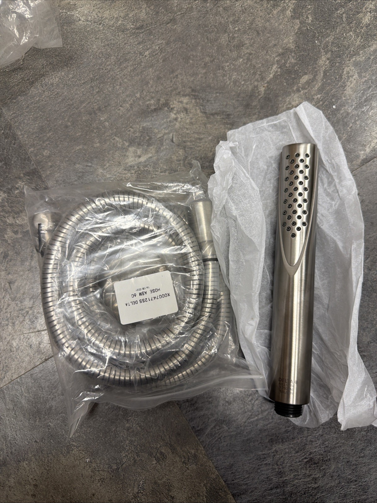 Delta Shower Hand Wand and Matching Hose In Brushed Nickel Delta Shower Hand Wand and Matching Hose In Brushed Nickel