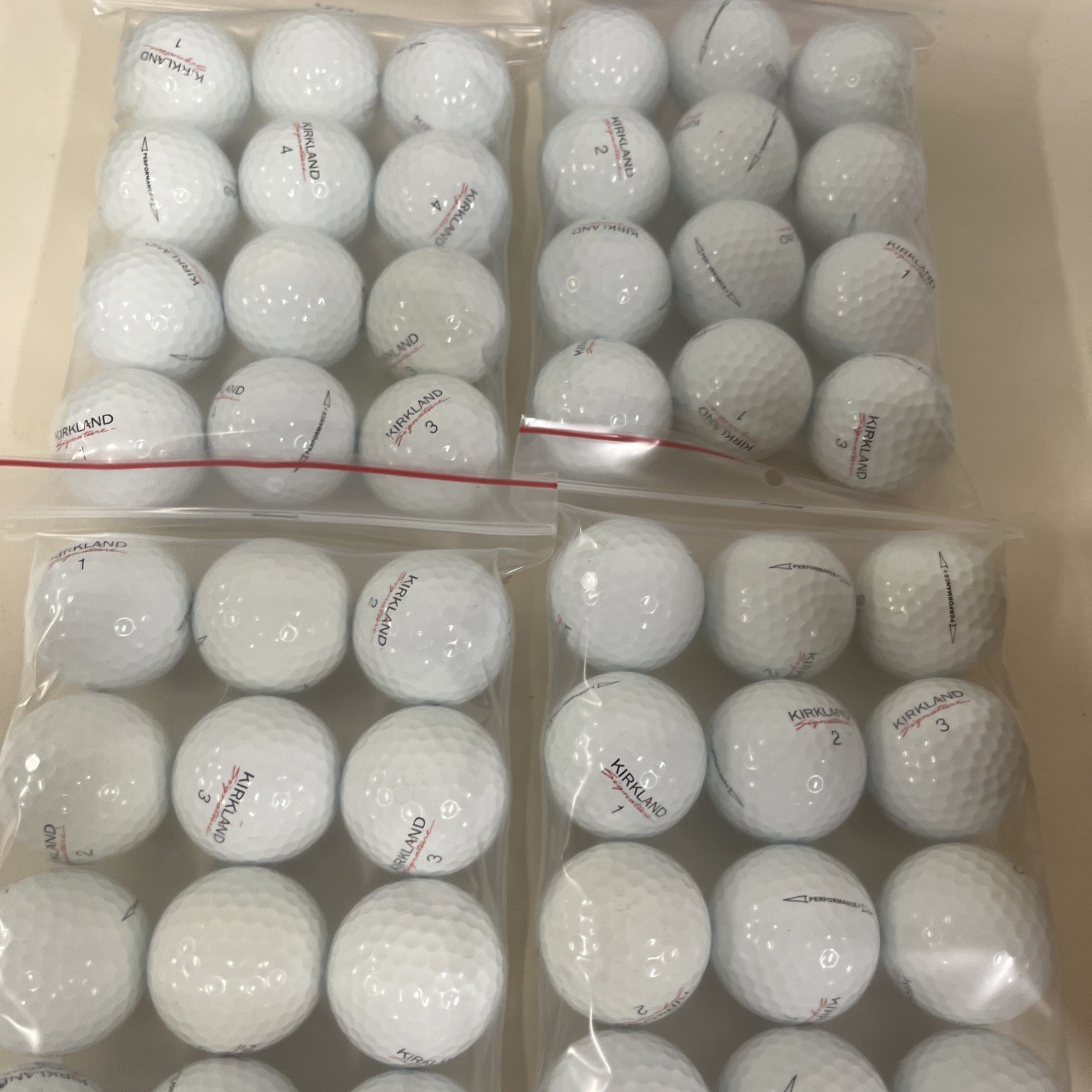 4 DOZEN 5A KIRKLAND PERFORMANCE (MINT) GOLF BALLS