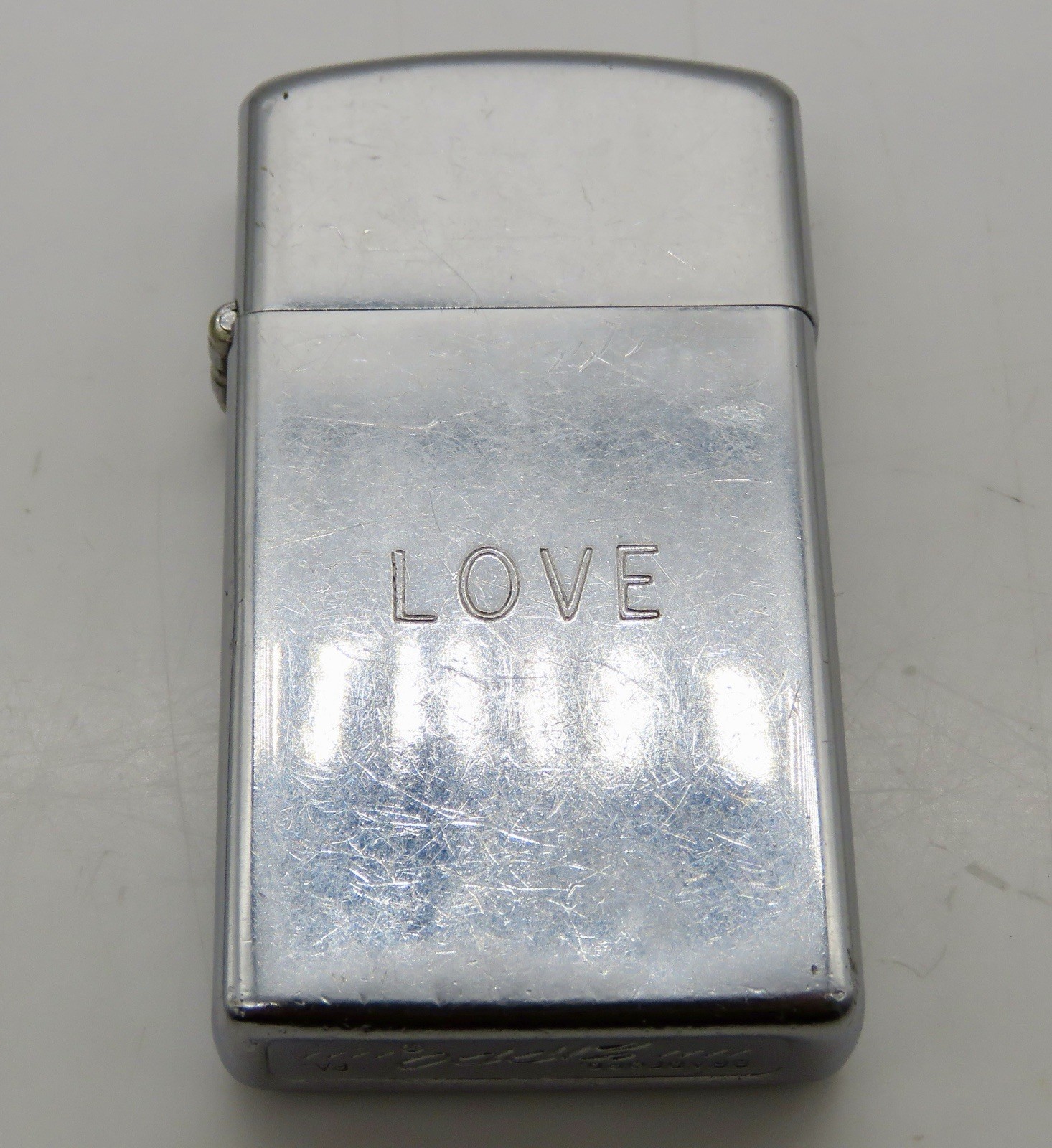 Vintage 1974 Chrome Slim Zippo Lighter - Engraved “LOVE”