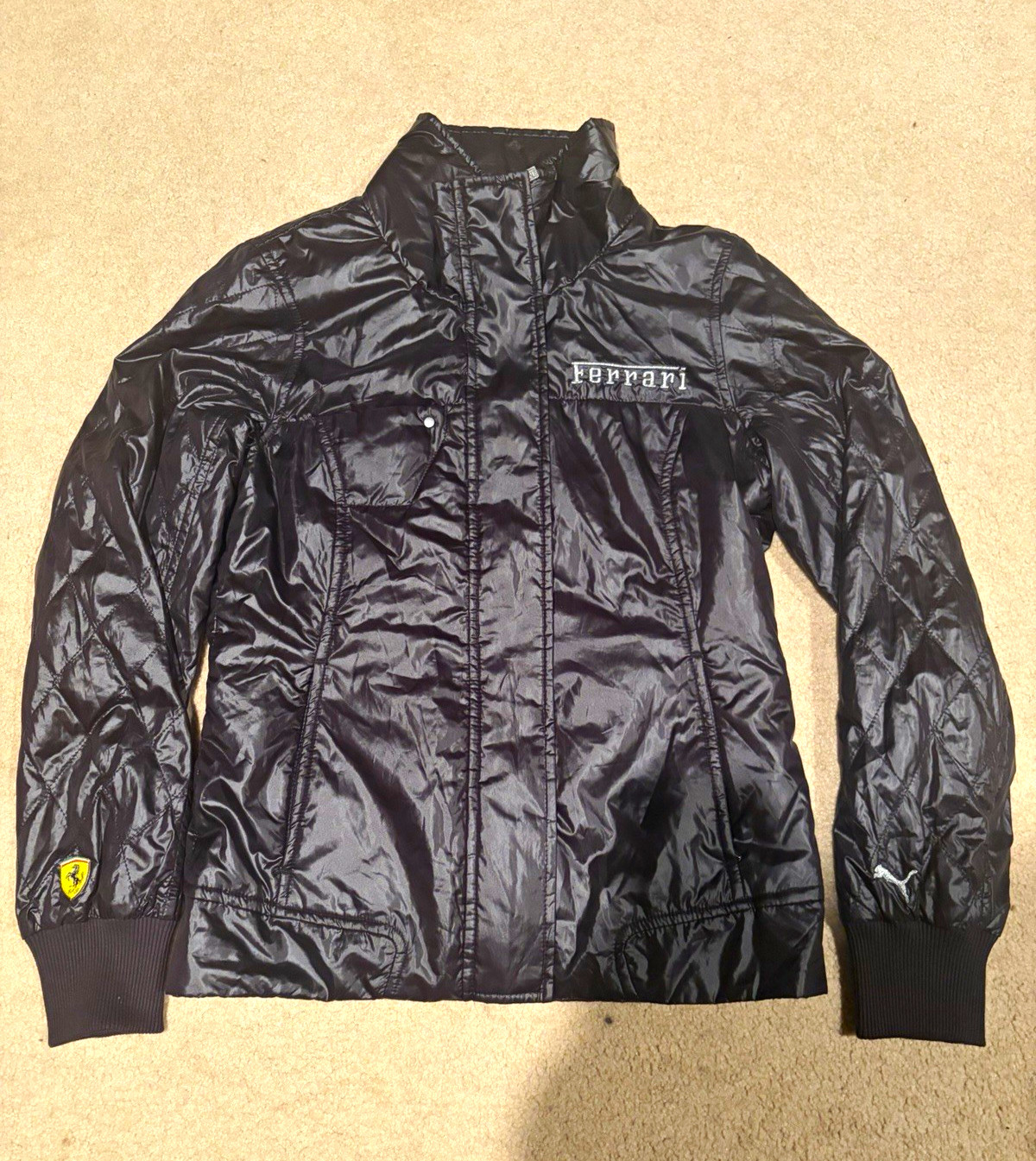 PUMA Ferrari Black Jacket Formula 1 Racing Apparel with Logo and Woven Sleeves PUMA Ferrari Black Jacket Formula 1 Racing Apparel with Logo and Woven Sleeves