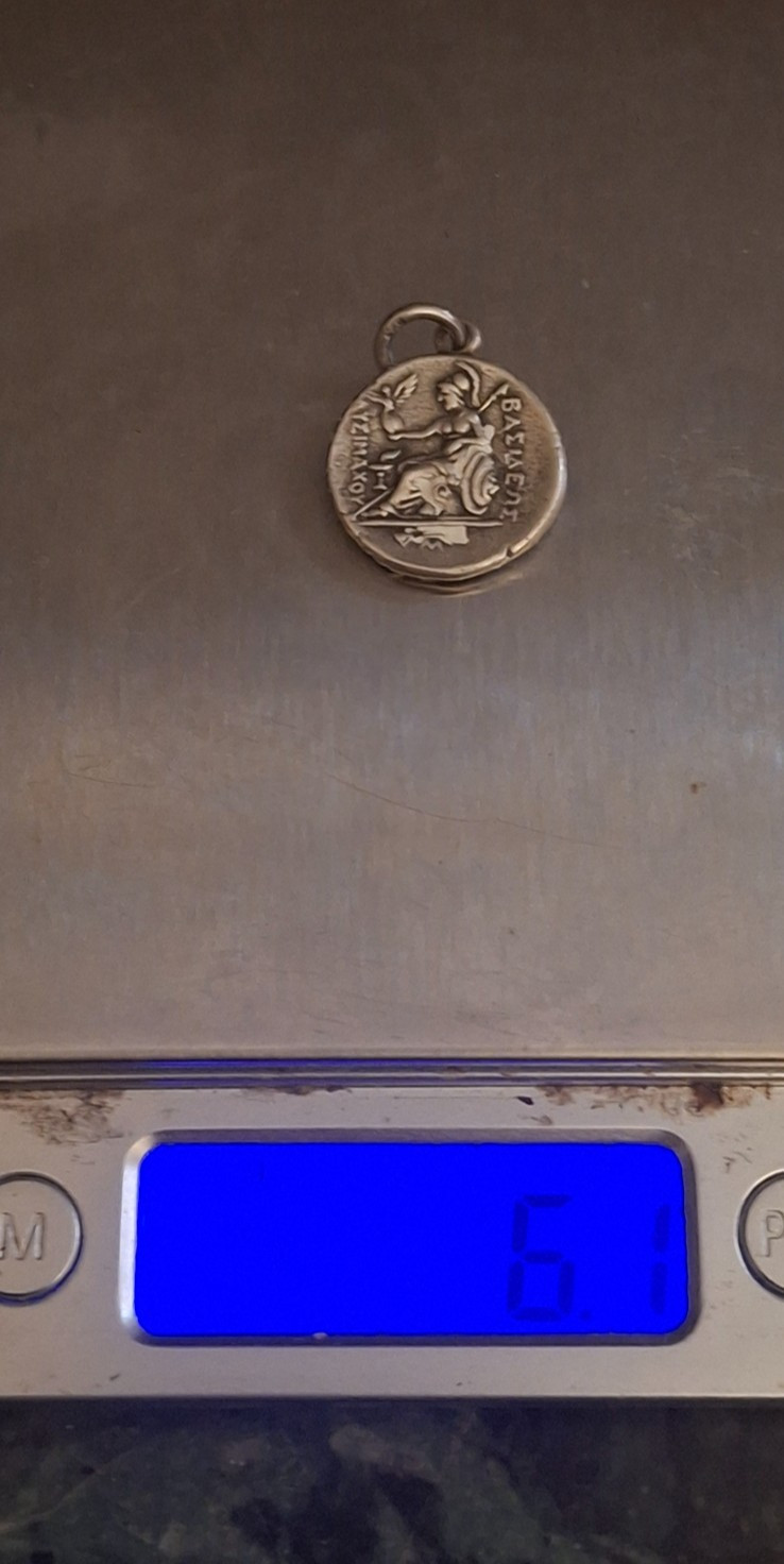 XFrare old Ancient Greek silver coin with QUEENS head on it. & HAS WRITING ON IT XFrare old Ancient Greek silver coin with QUEENS head on it. & HAS WRITING ON IT