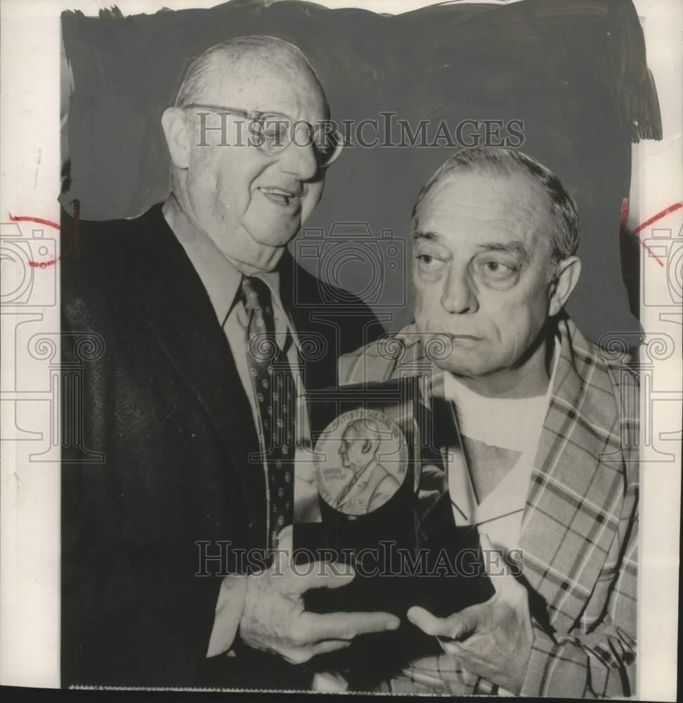 1955 Press Photo Comedian Buster Keaton receives a 