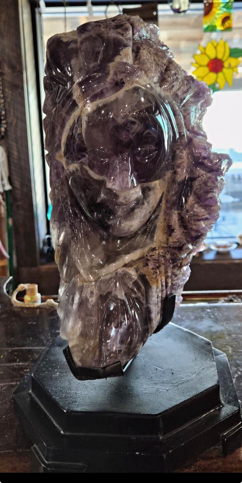 Purple Amethyst Crystal Carved Indian Chief w Black Display Stand that turns Purple Amethyst Crystal Carved Indian Chief w Black Display Stand that turns