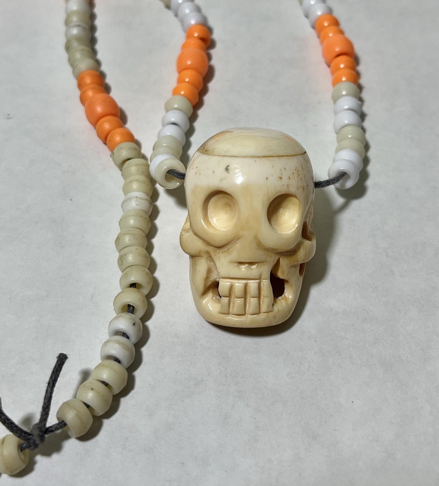 Vintage Hand Carved Yak Bone Skull Bead Necklace Orange White Barrel Beads 22”
