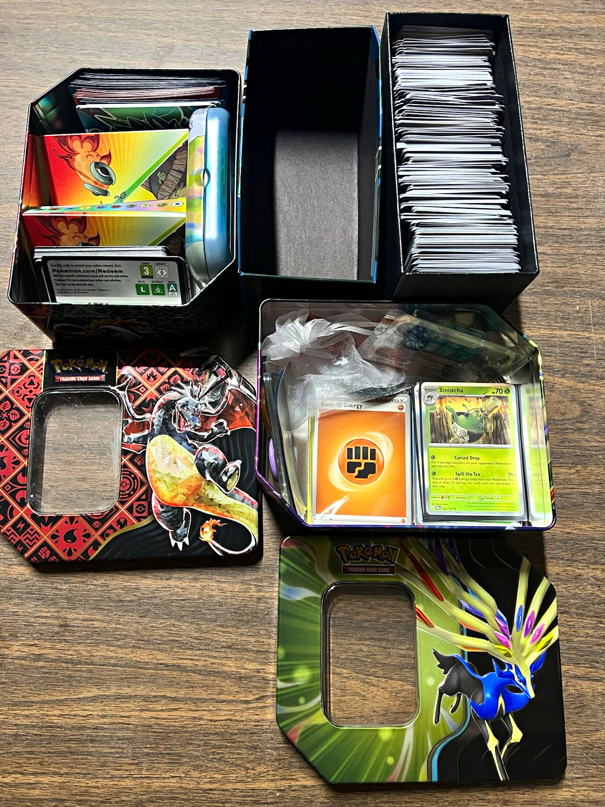 Pokémon TCG Mixed Card Lot w/ Tins, Sleeves, Dice, Coins Pokémon TCG Mixed Card Lot w/ Tins, Sleeves, Dice, Coins