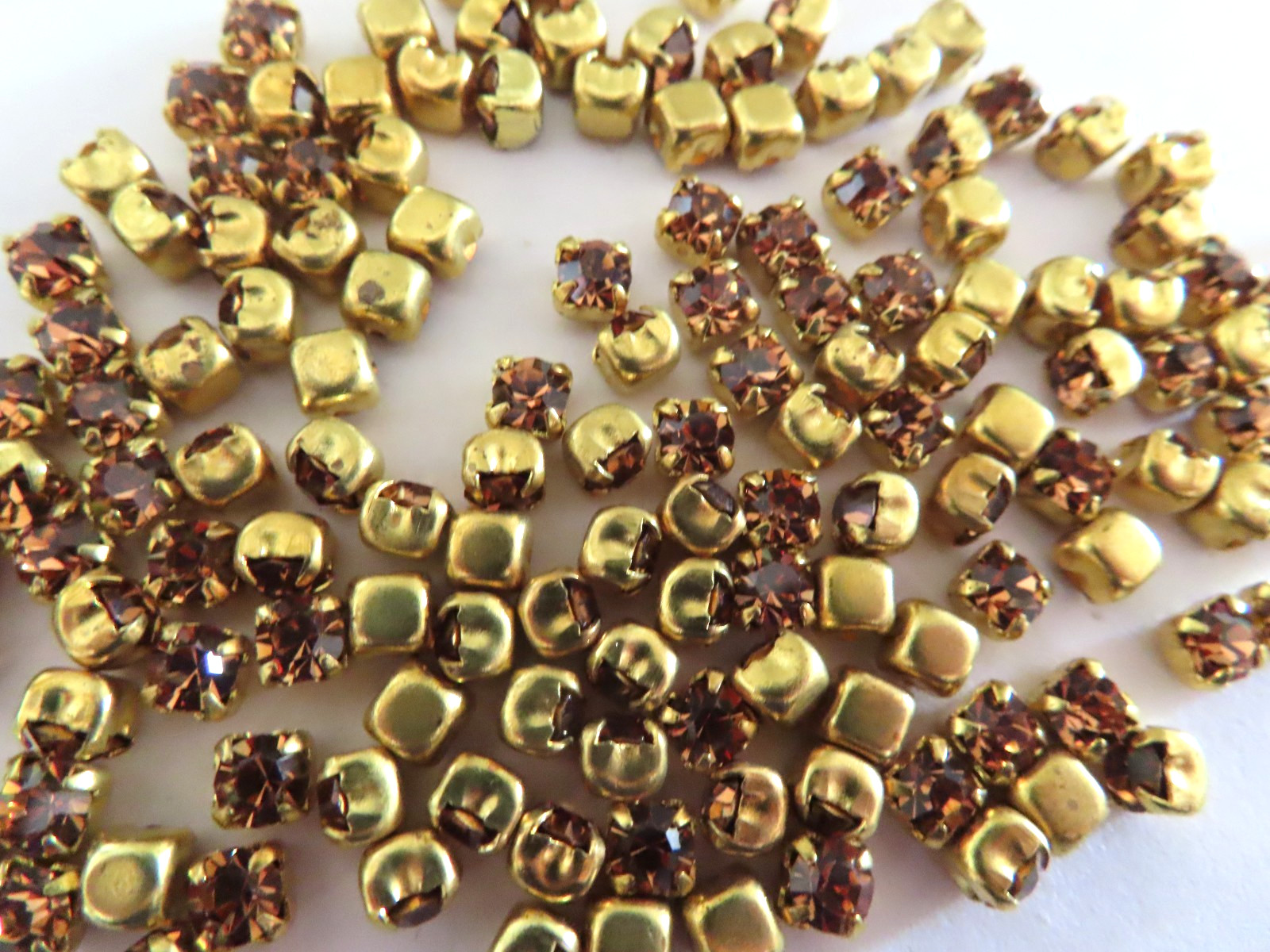 144 Swarovski Rhinestones 17ss Light Smoked Topaz/Square brass settings.