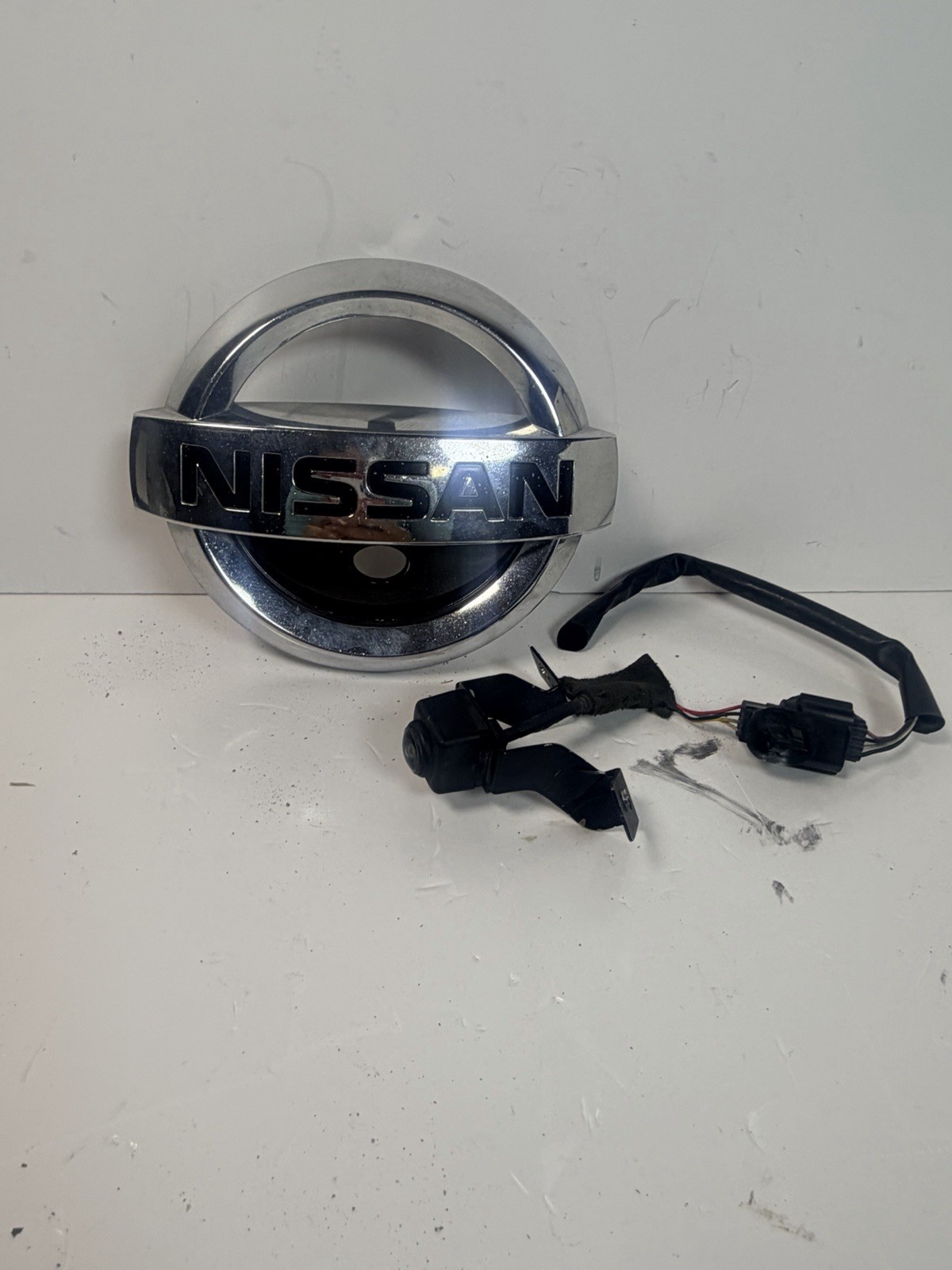 2017-2021 Nissan Pathfinder Front Grille Emblem w/ Park Camera OEM 62890-9PF0B